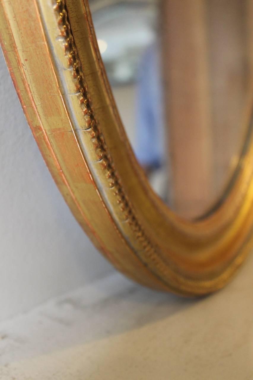 Composition 19th Century French Ripple Style Oval Mirror with Mercury Plate For Sale