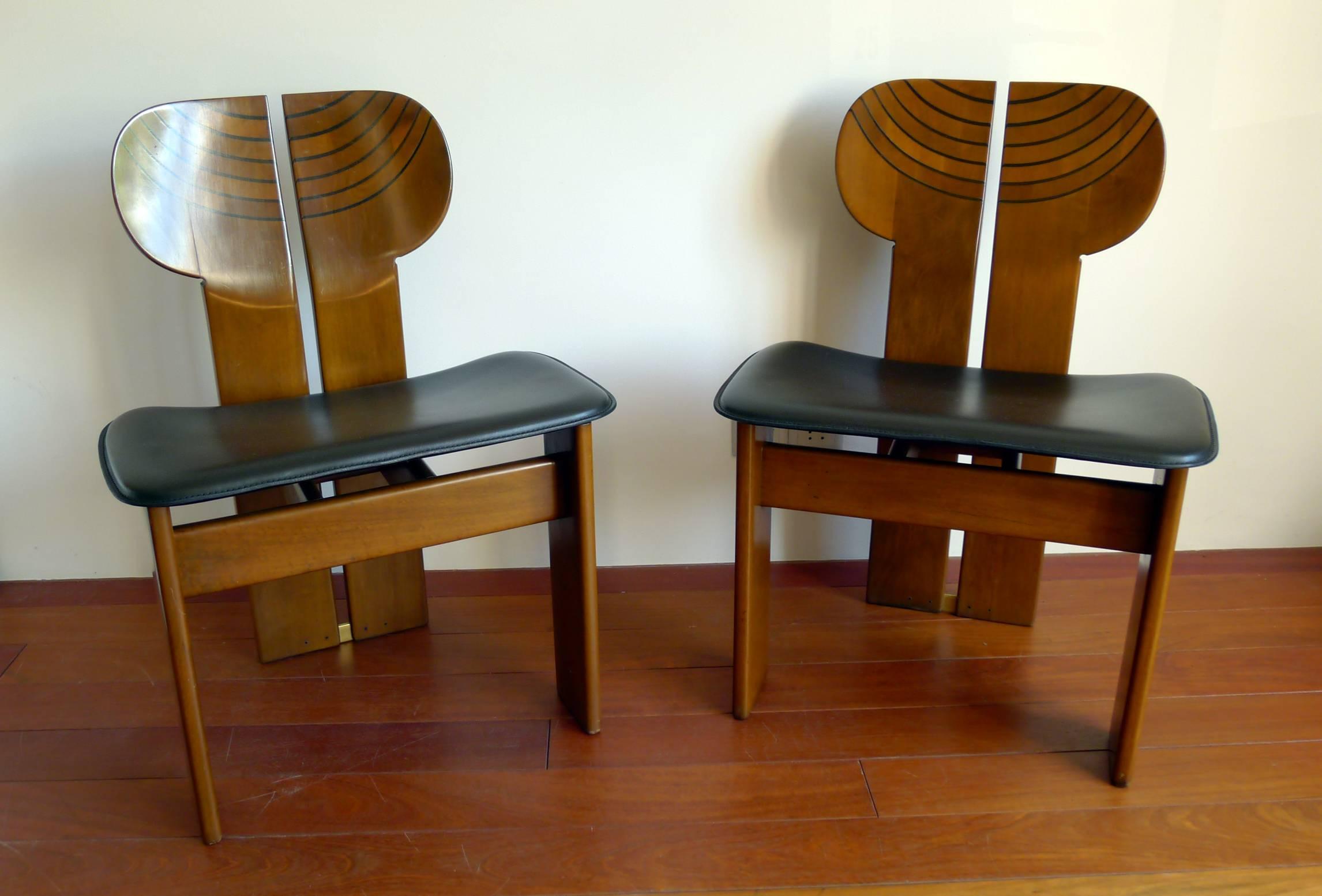 Produced by Maxalto Italia, the Artona series, a pair of Africa dining/side chairs, designed by Afra and Tobia Scarpa in 1975.
Beautifully handmade out of walnut and ebony with brass parts, black leather seat.
    
