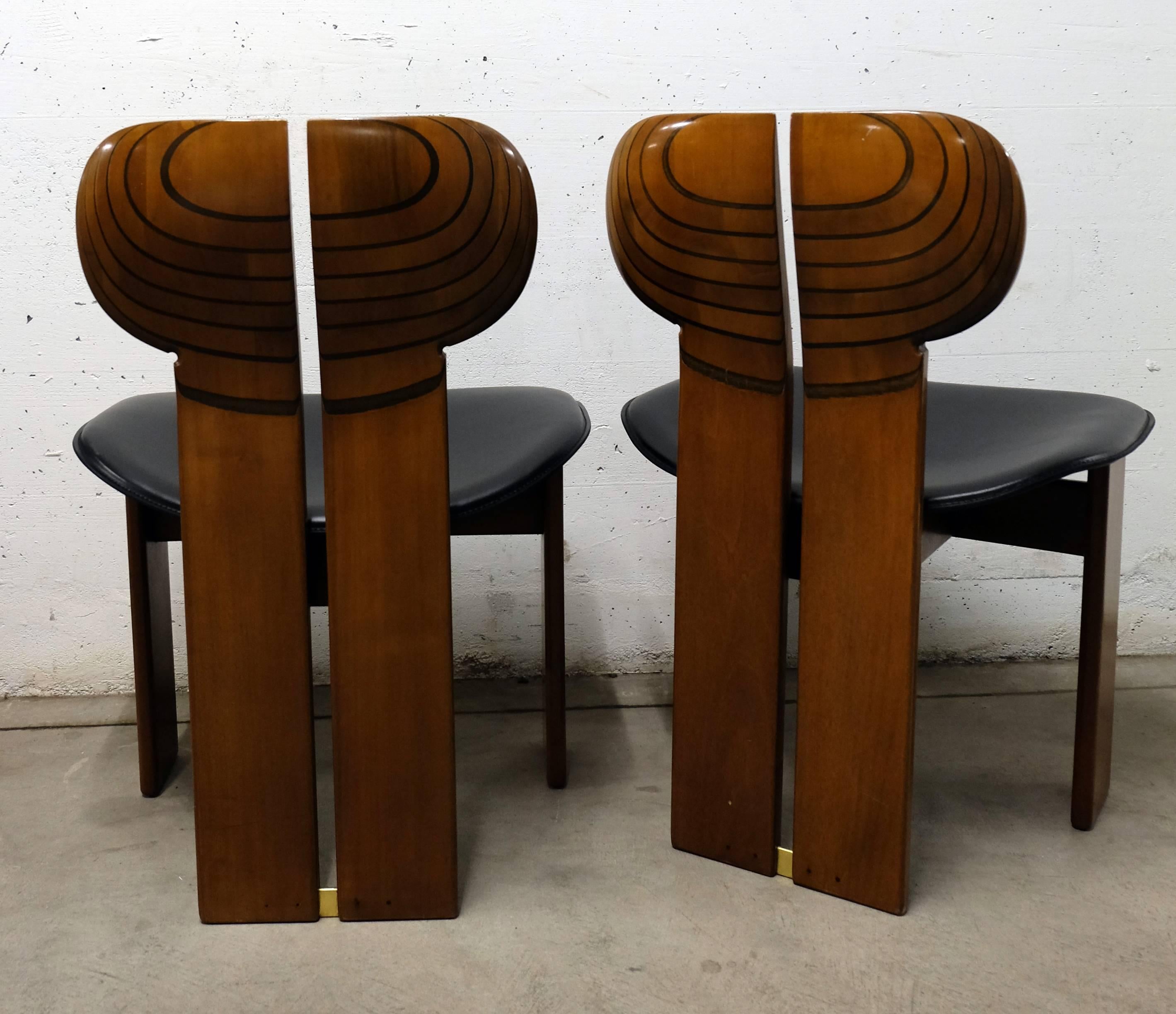 Produced by Maxalto Italia, the Artona series, a pair of Africa dining/side chairs, designed by Afra and Tobia Scarpa in 1975.
Beautifully handmade out of walnut and ebony with brass parts, black leather seat.
  