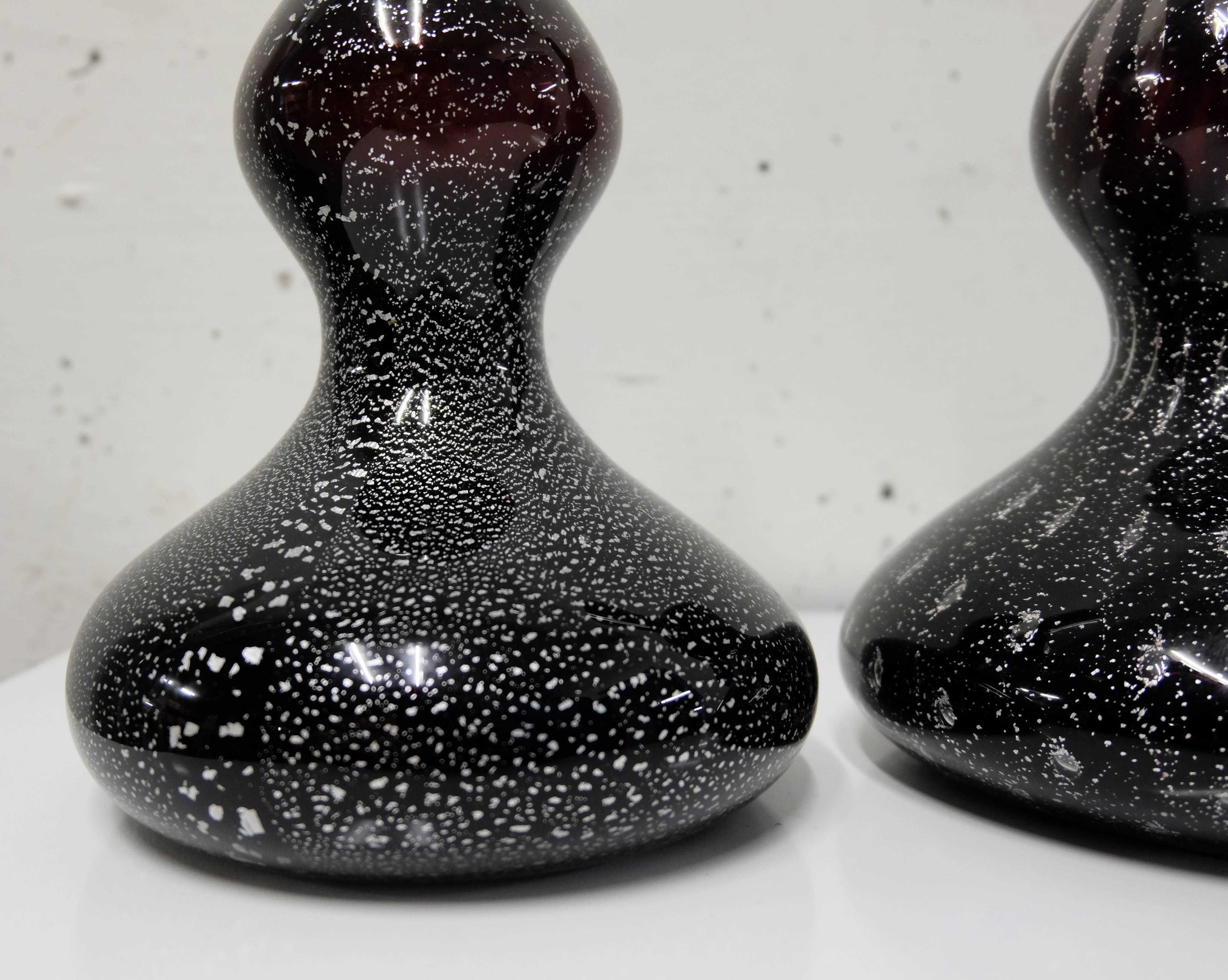 3 black soliflor vases designed by swiss architect Christian Geissbuhler with Compania Vetraria Muranese in Murano Venezia
Blown black Murano glass with silver inlays, all different
Purple reflections when enlightened
Signed and numbered
