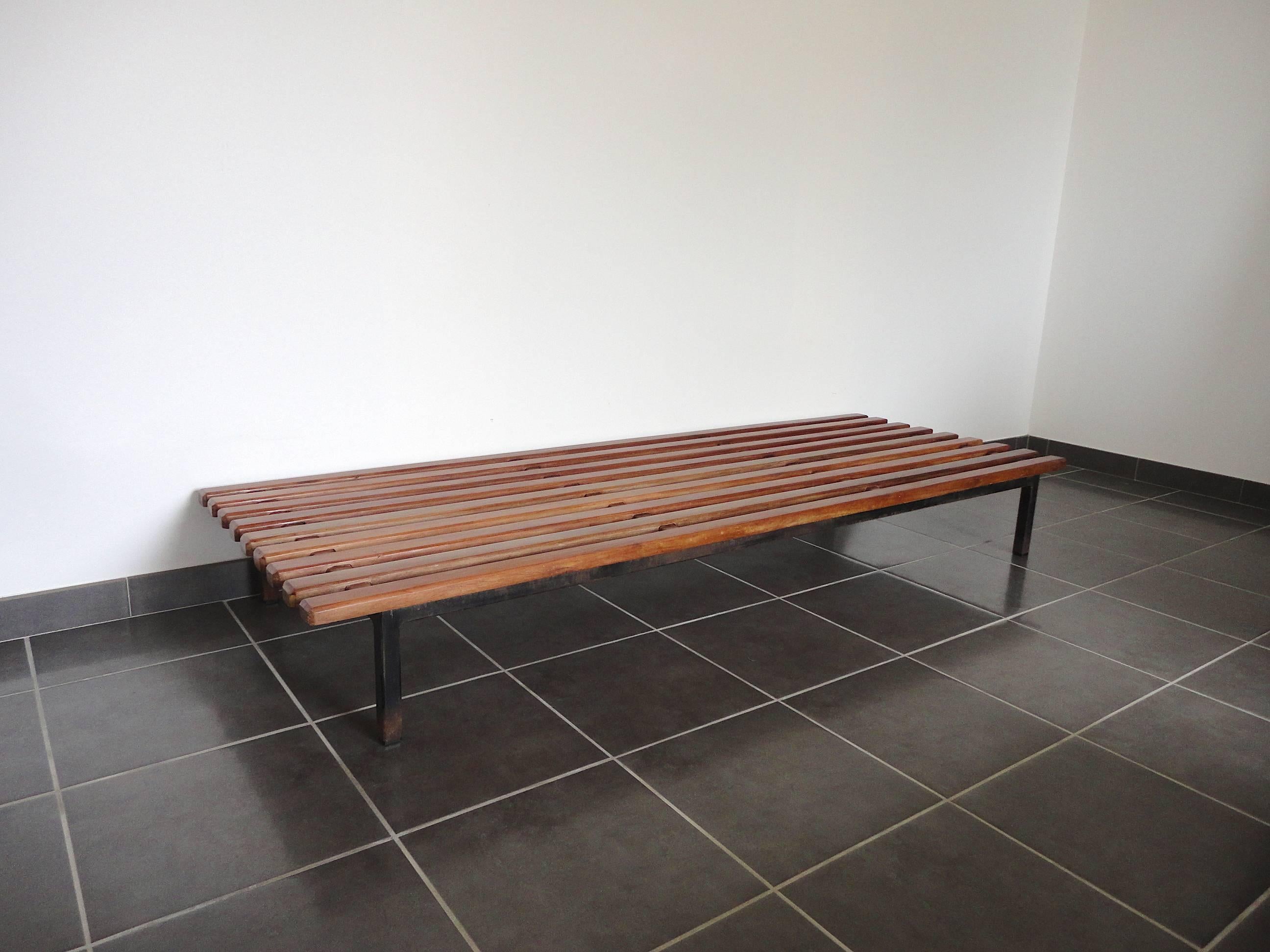 Slat bench or coffee table designed by Charlotte Perriand and produced by Steph Simon. It was made and used in the North African mining town of Cansado, Mauritania in the late 1950s. It features nine mahogany slats on a metal frame with four legs.