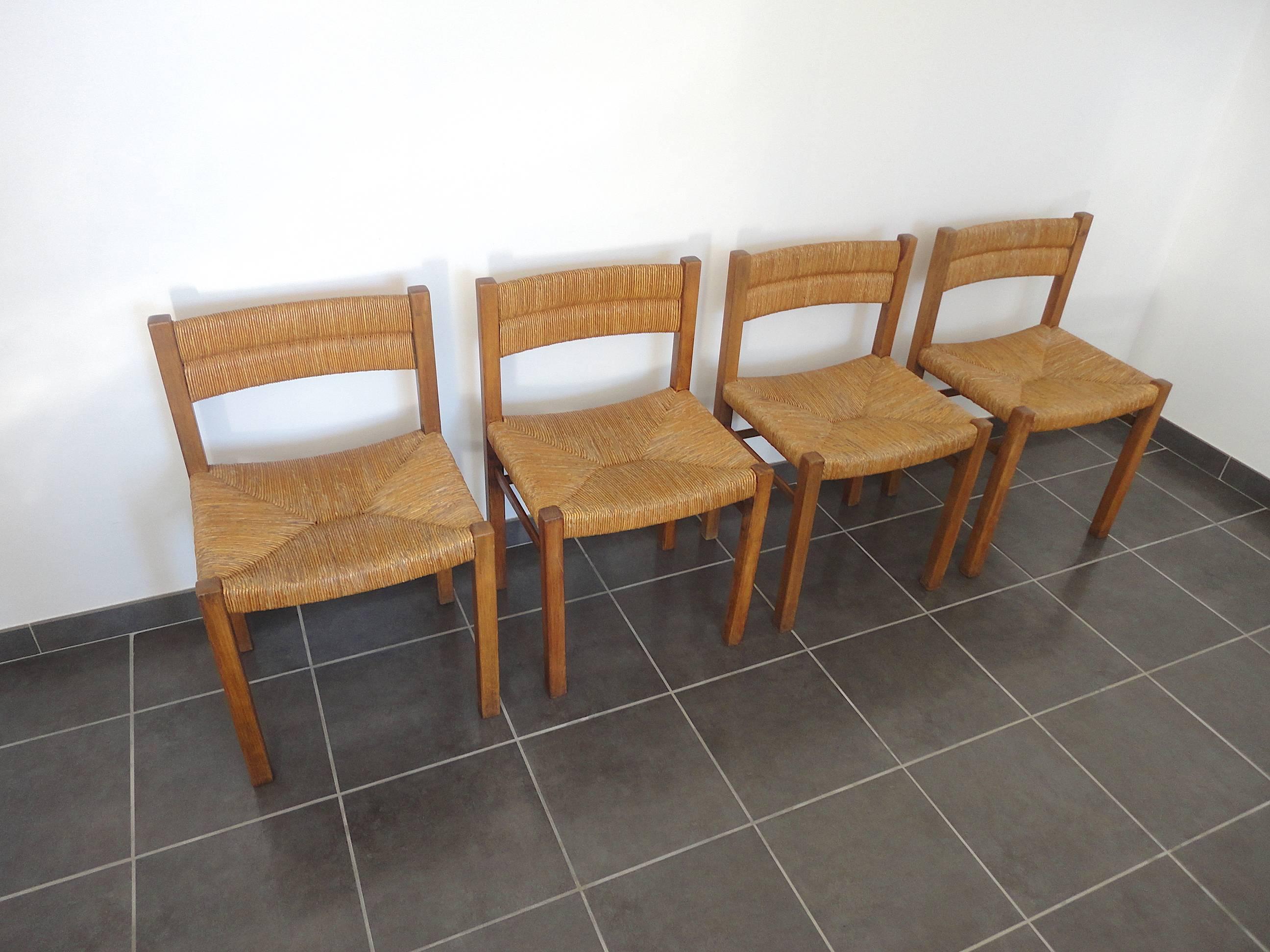 Fully original set of four dining chairs by Pierre Gautier-Delaye, designed in 1954. This early edition set was produced by French manufacturer Meubles Weekend. Made from wood and rush.
Pierre Gautier Delaye was awarded the Rene Gabriel Prize in