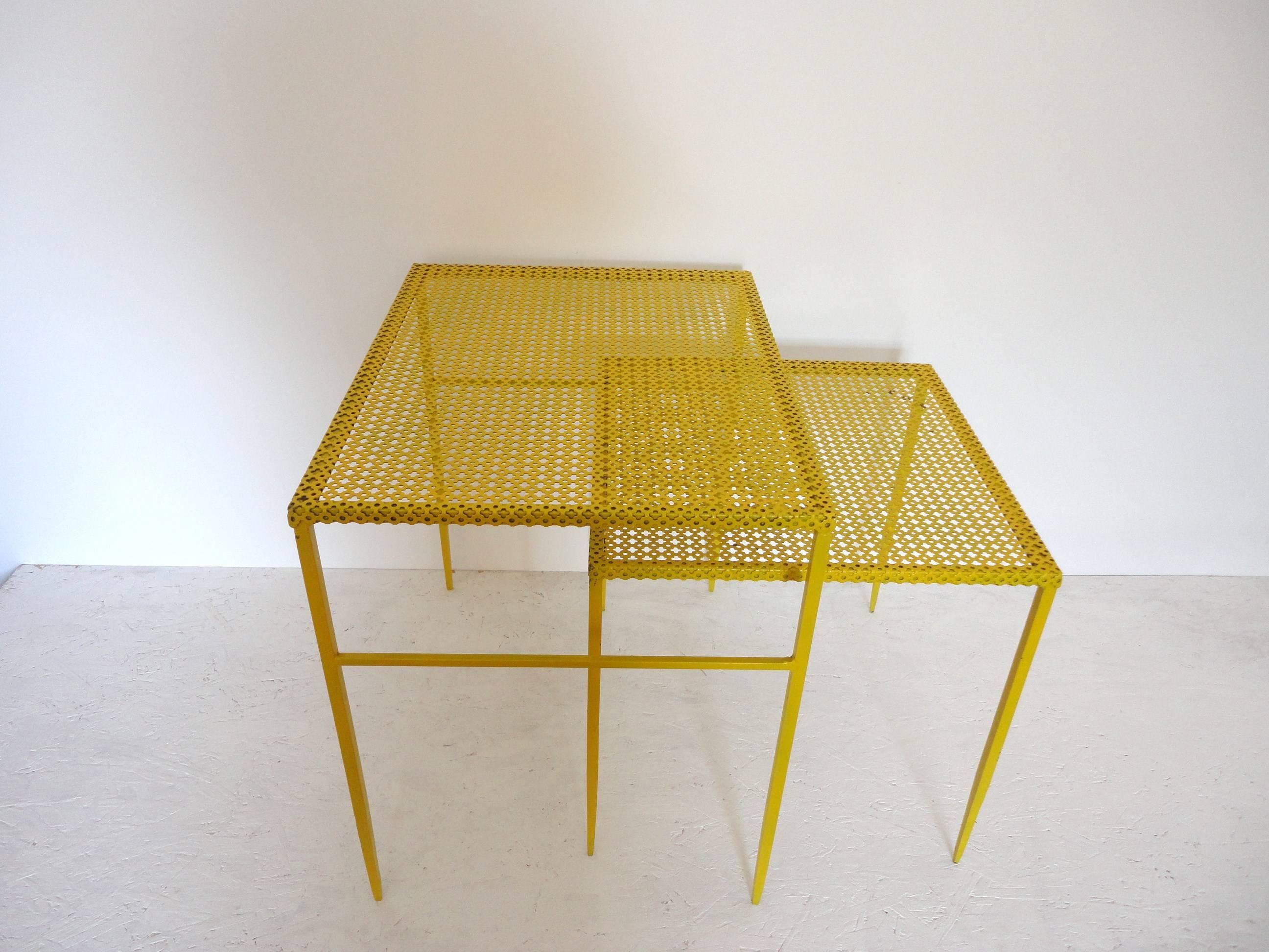 Set of two end tables by Mathieu Mategot. 
Perforated lacquered metal. 
Documented in the book "Mathieu Mategot" Patrick Favardin page 50. 
The larger table measures 52 x 53 x 42.5 cm. The smaller table measures 42.5 x 43 x 43 cm.
 