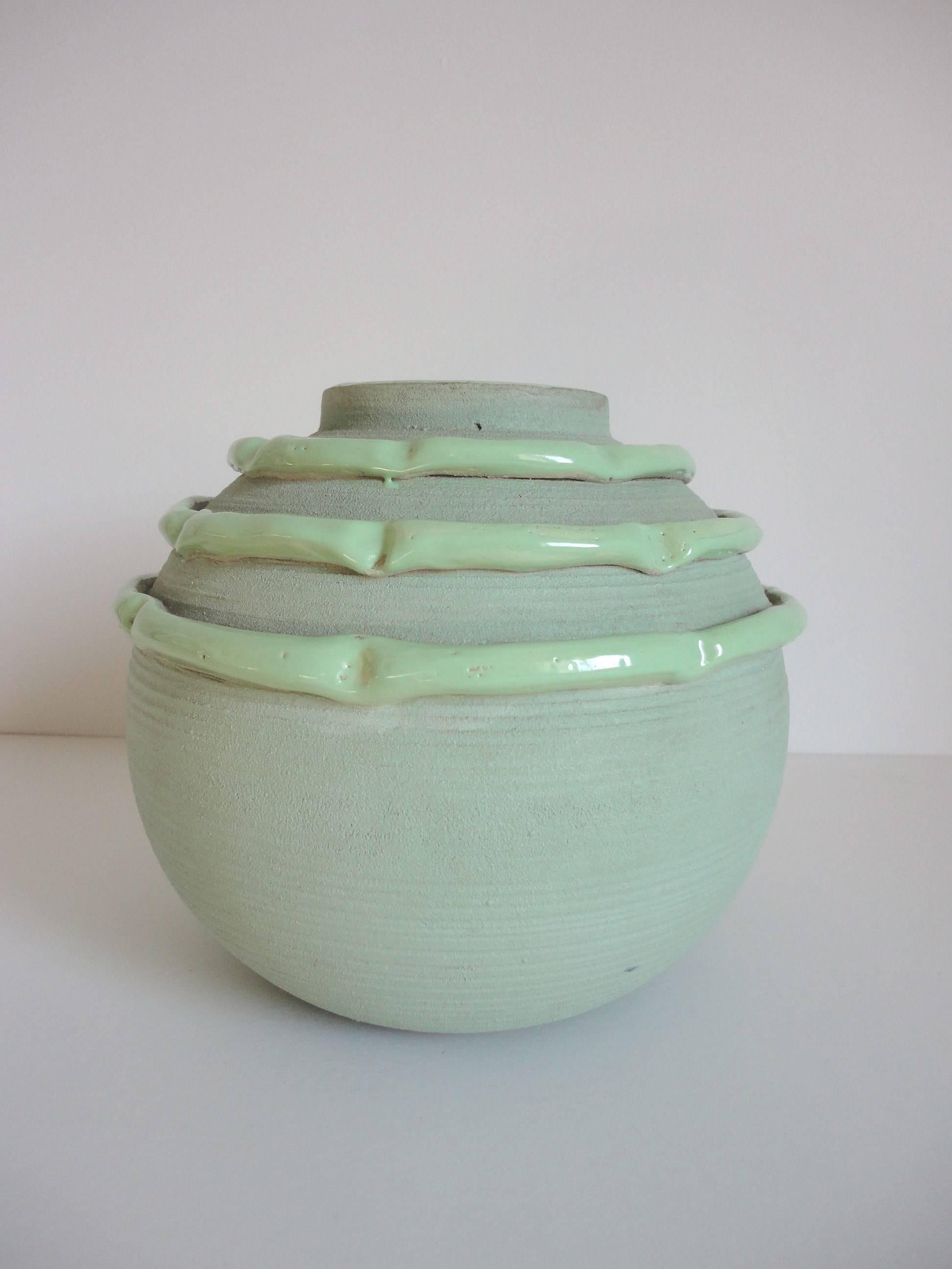 Ceramic vase by Luc Lanel, circa 1940, in light green with a matte and gloss finish.
It is signed 'M Luc Lanel'.
Luc Lanel is widely known for his collaboration with Christofle in the 1920s and 1930s where he worked as artistic director. His wife,