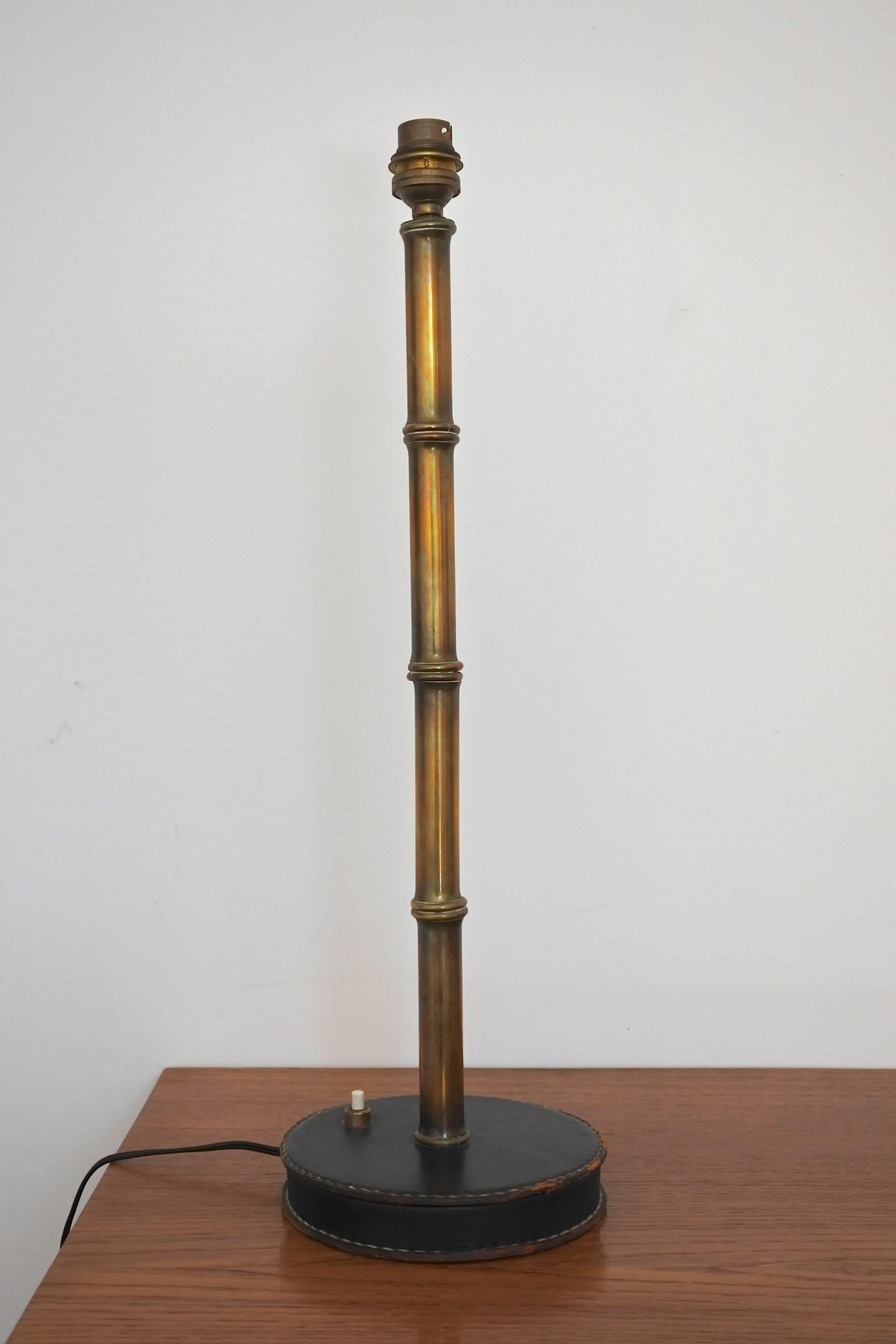 Mid-Century table lamp by French designer Jacques Adnet.
Faux bamboo solid brass and hand-stitched black leather.
A similar lamp is documented in the book "Jacques Adnet" by A-R Hardy Les Editions de L'Amateur page 243.
Dimensions