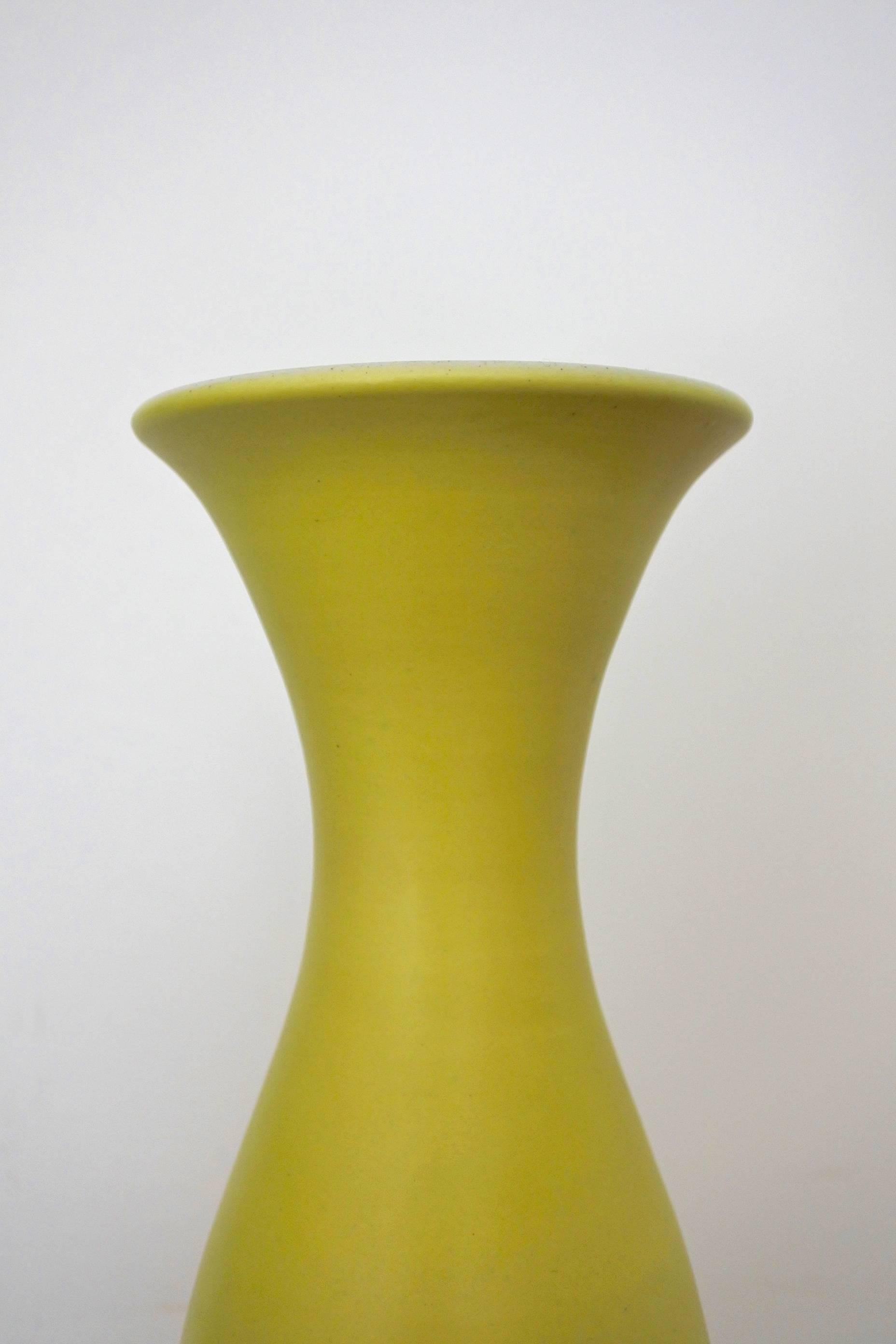 Midcentury ceramic vase by renowned French pottery artist Pol Chambost.
Signed Pol Chambost Made in France 1069
Pastel yellow satin glaze on the outside, satin white glaze on the inside.
Documented in the book Pol Chambost, sculpteur céramiste,