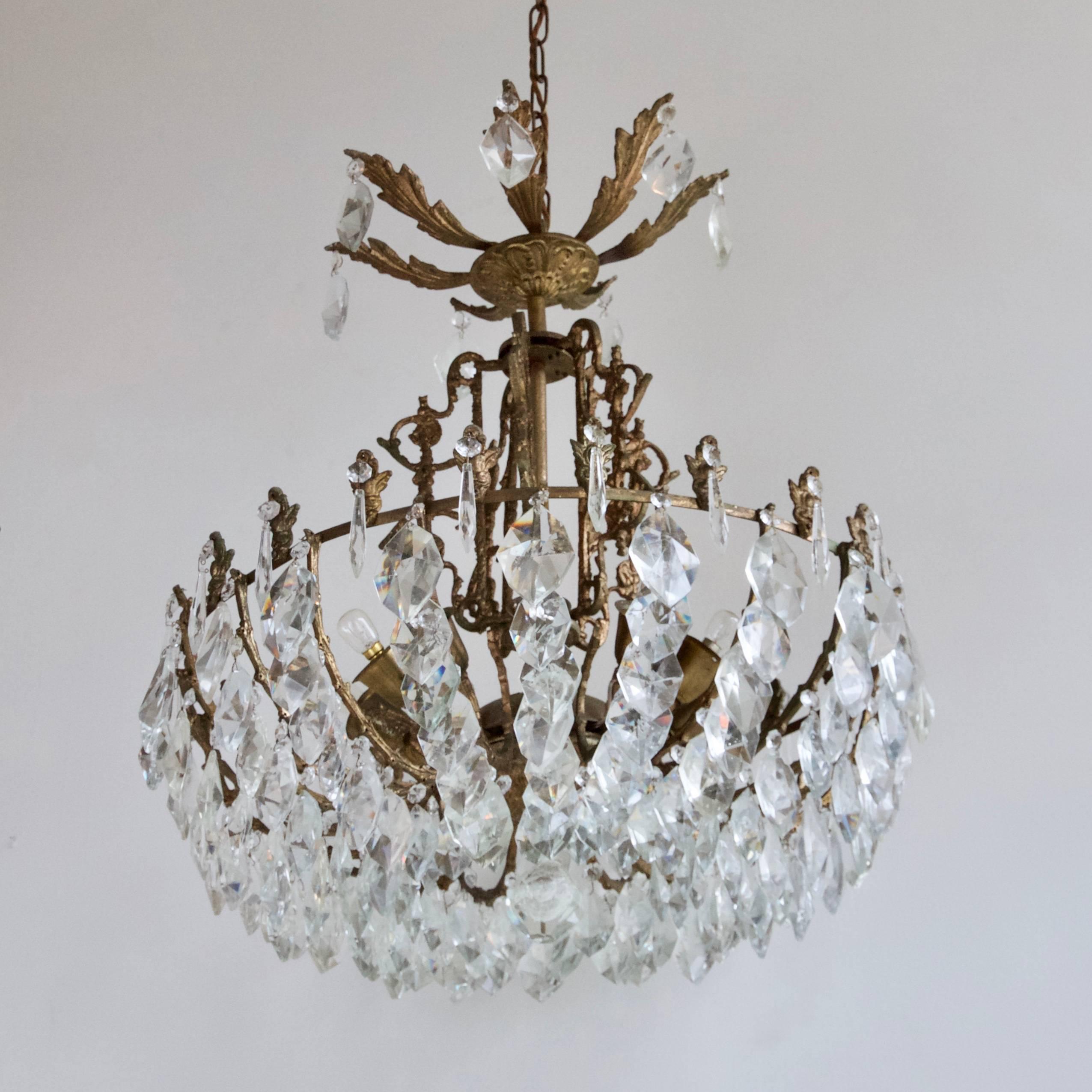 Early 1900s, French multi-arm chandelier with large hand-cut crystal iceberg drops. This chandelier has ten lamps SBC, B15.