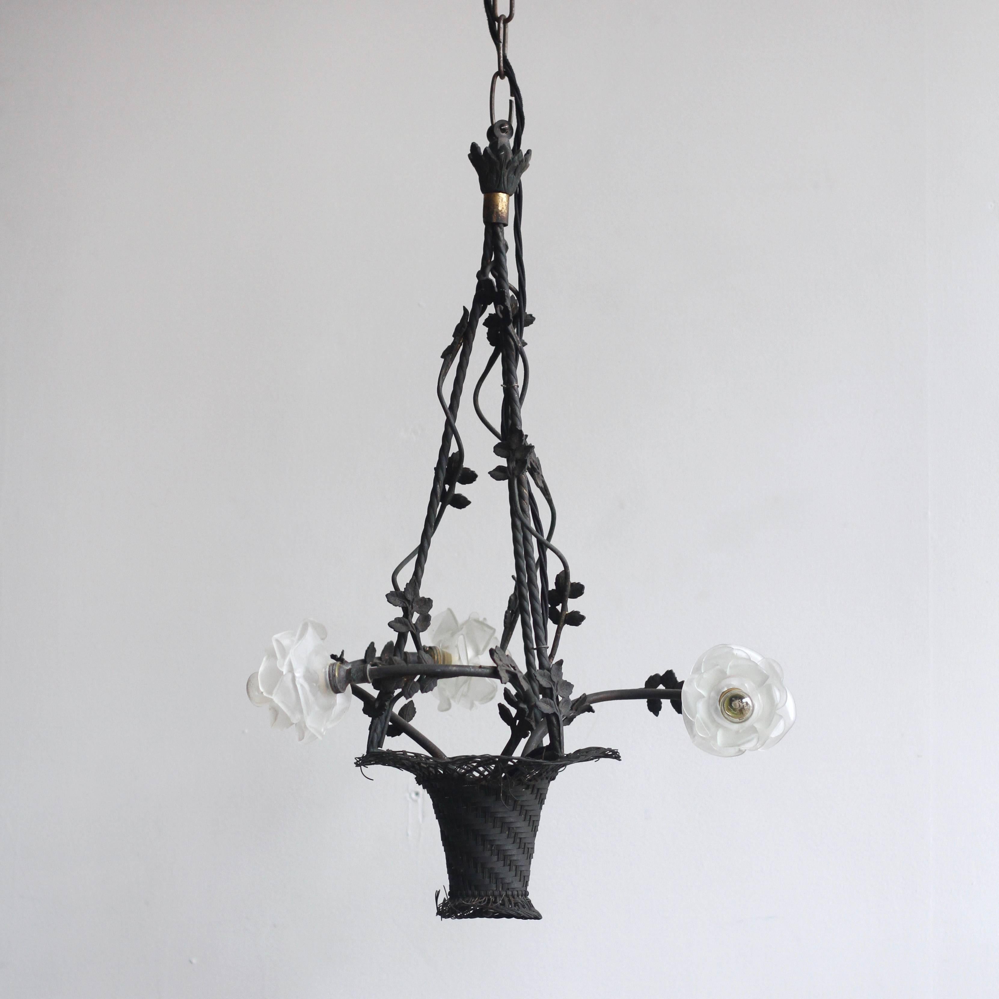 French early 1900s handmade wrought iron floral basket chandelier with original frosted floral glass shades. The iron work is decorative and ornate. It has been sympathetically restored to retain the beautiful patina that has developed over time