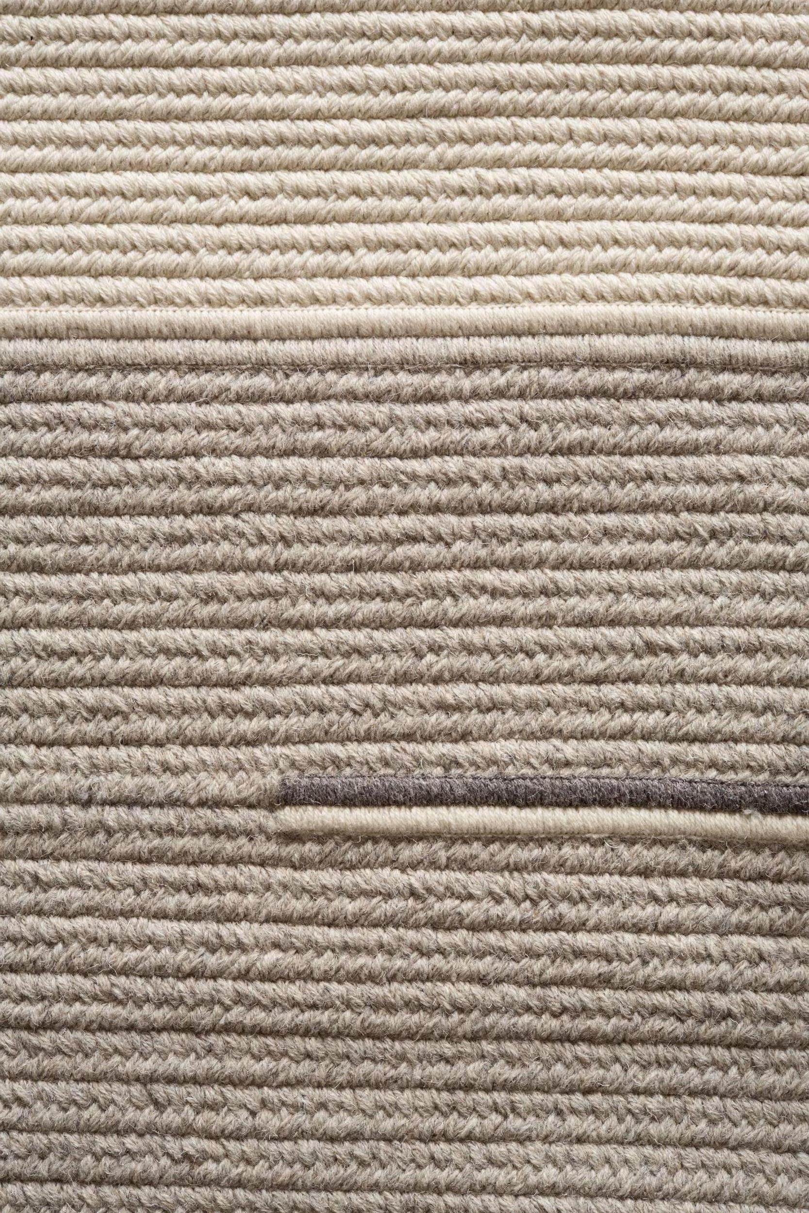 Line No. 1 light grey chunky textured natural-undyed wool 8'x10' reversible rug, designed and crafted in the USA.

The Line No. 1 rug is a Minimalist inspired rug focused on creating texture and balance through line and material. Each piece is