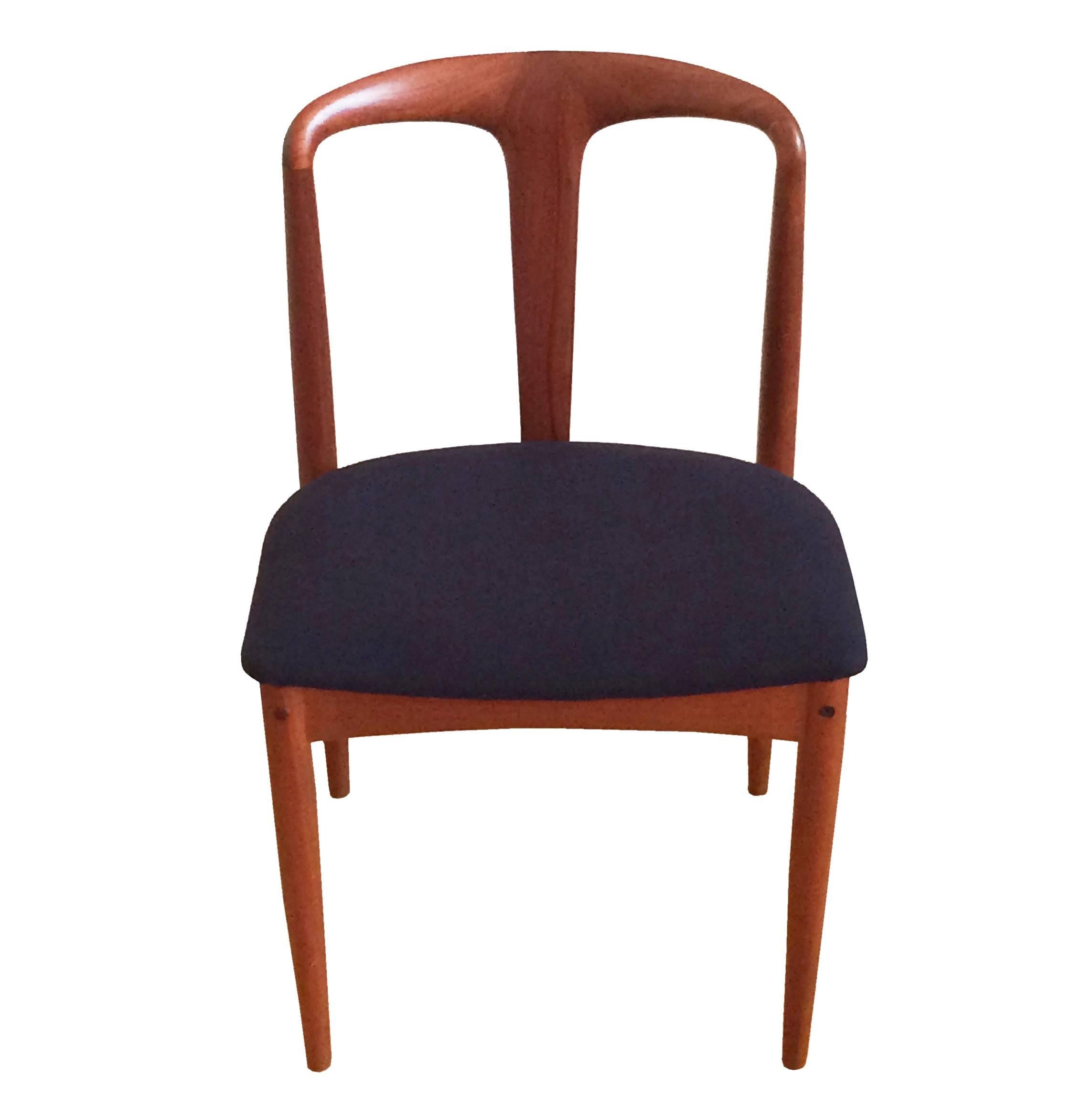 This Danish Mid-Century 'Juliane' chair was designed by Johannes Andersen for Uldum during the 1960s. The design features an organic style, seat is re-upholstered in navy cashmere. The original brown fabric remains under this easily removable fabric
