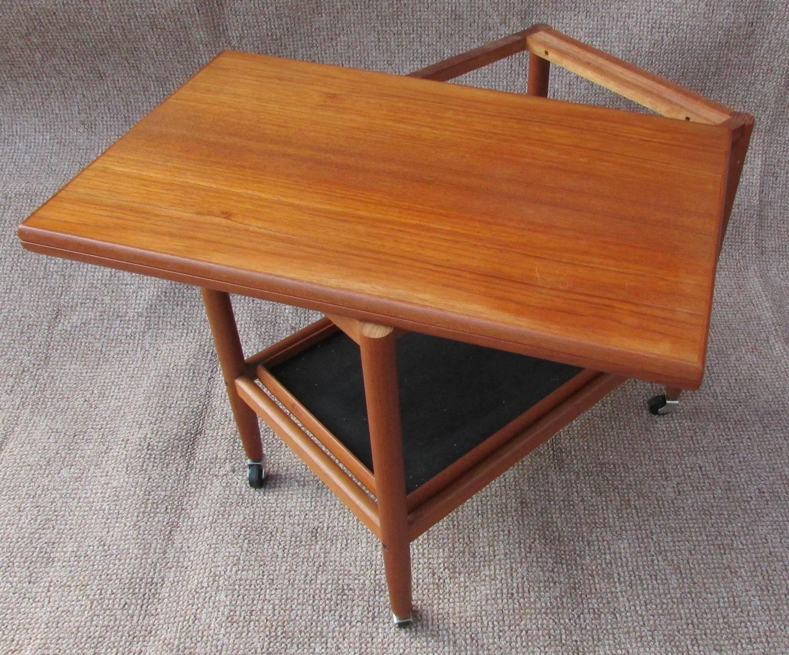 Mid-Century teak Danish extending drinks trolley folding table by Arrebo, 1960s teak extending drinks trolley, a wonderful quality Danish made piece of furniture from the 1960s. This tabletop smoothly extends by swivelling the top surface and