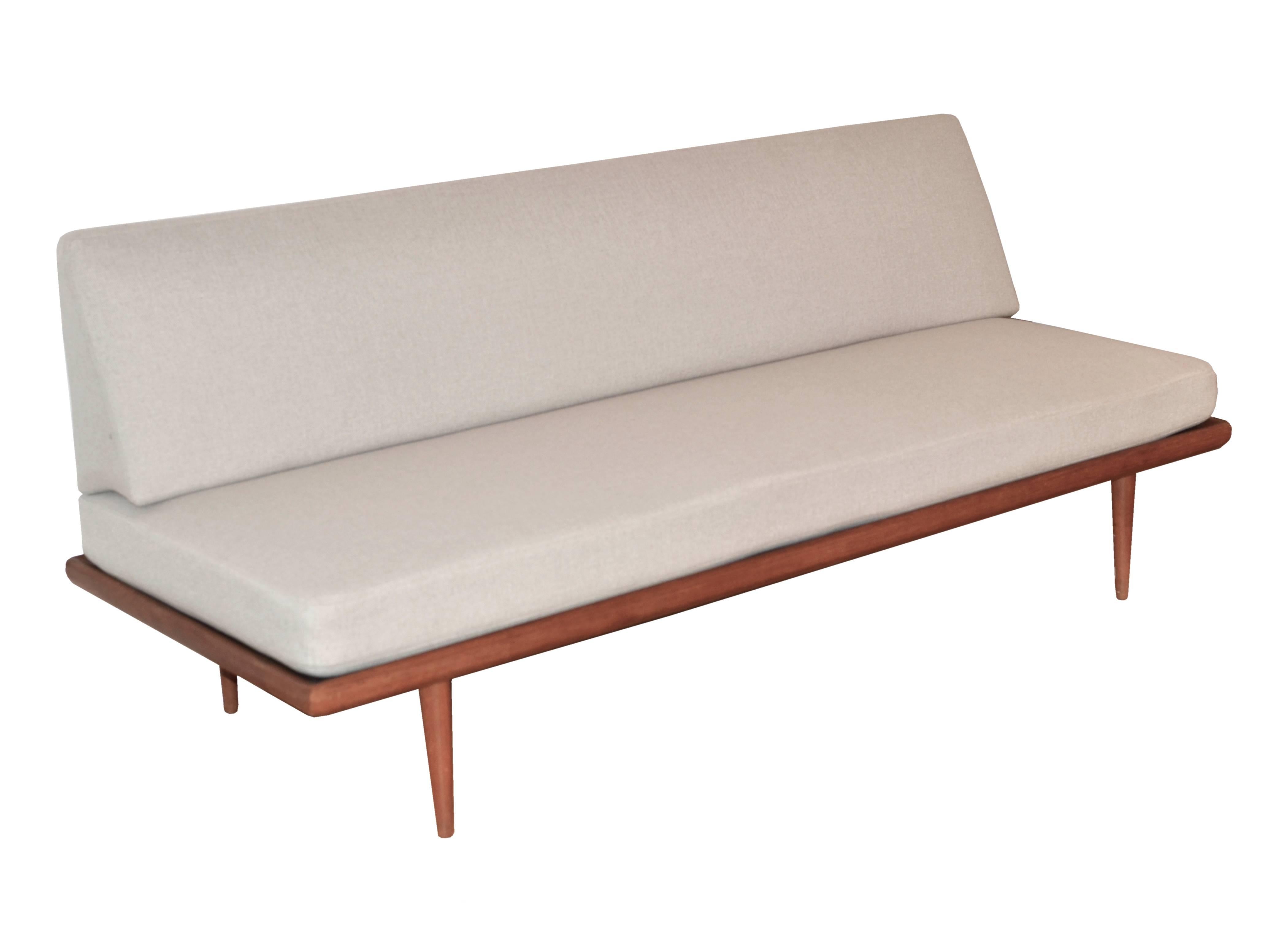 This Minerva sofa and daybed was designed by Peter Hvidt & Orla Mølgaard-Nielsen and produced in the 1960s by France & Son in Denmark. It is made from solid teak and features a new upholstery and off-white fabric (a spare set in different