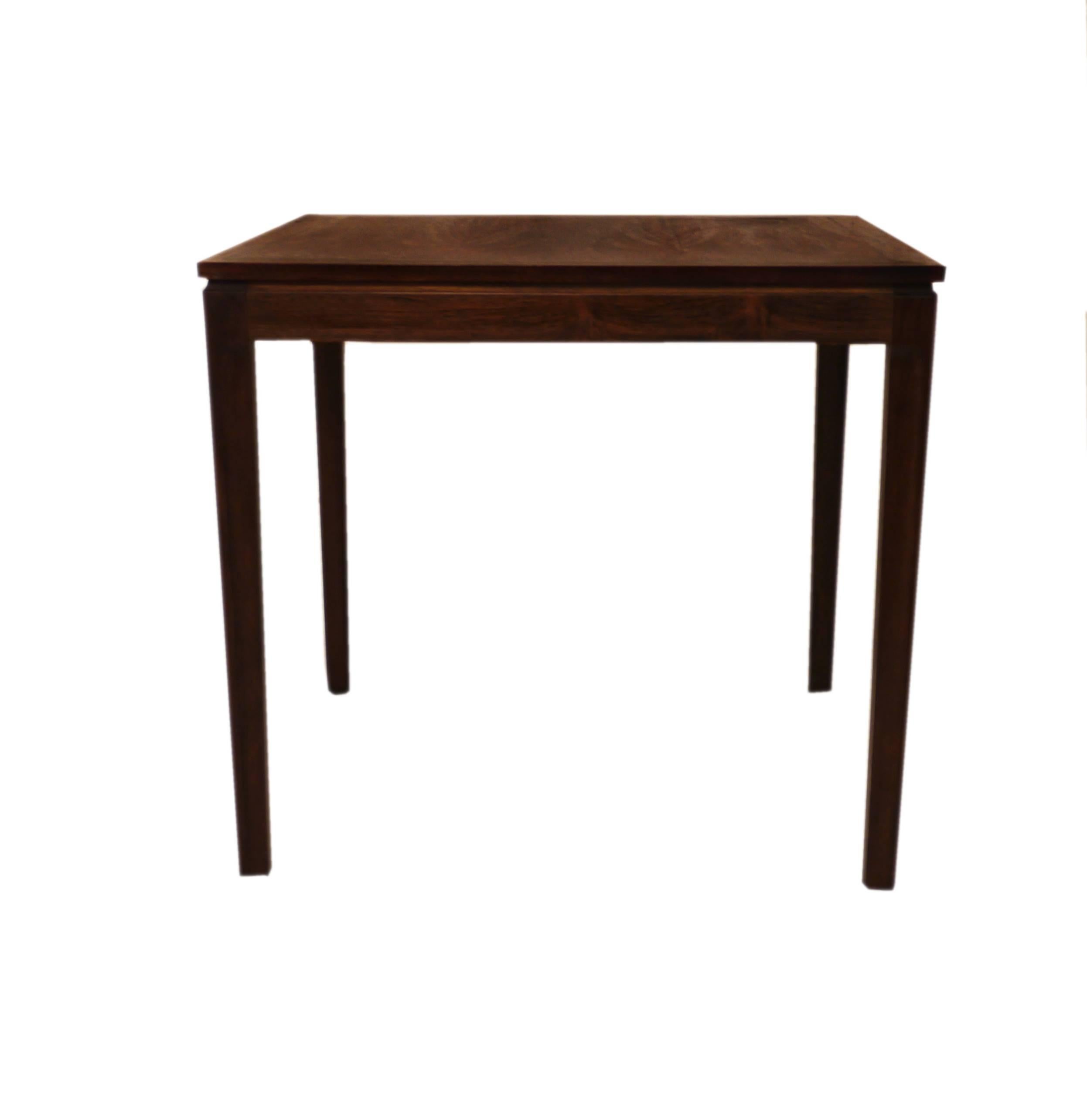 Danish furniture makers, produced in the 1960s. Side or sofa table made in rosewood with amazing wood grain, which is rich in contrast. Legs can be dismounted.
 