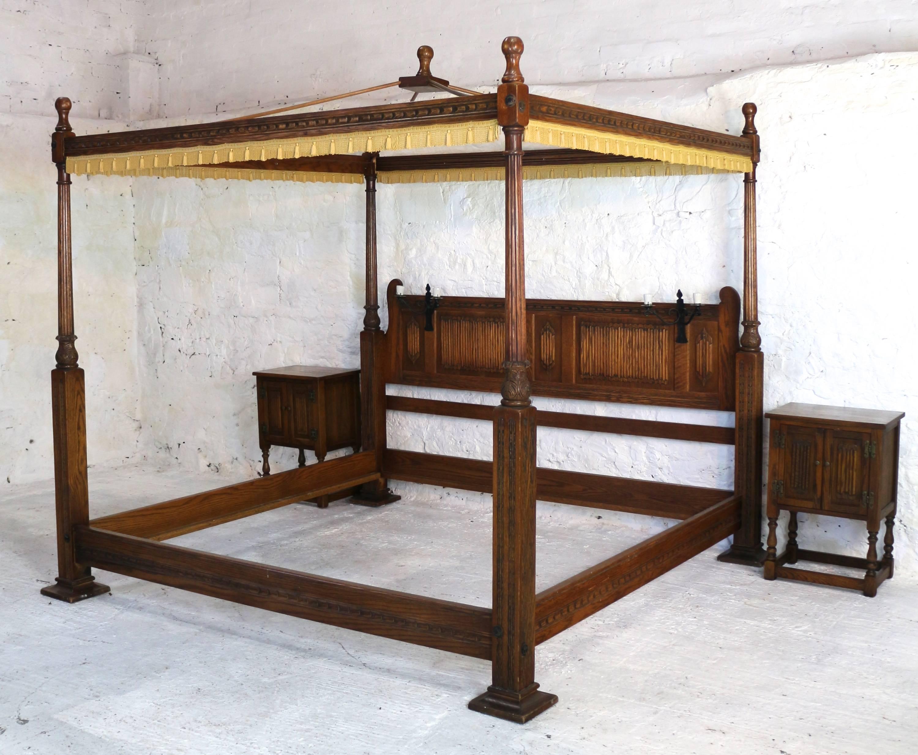 A fabulous opportunity to own a rare Emperor size four-poster bed. This super bed was designed in the Elizabethan style by Wood Brothers for the Old Charm range as a Limited Edition to celebrate the Silver Jubilee of Elizabeth II. With reeded and