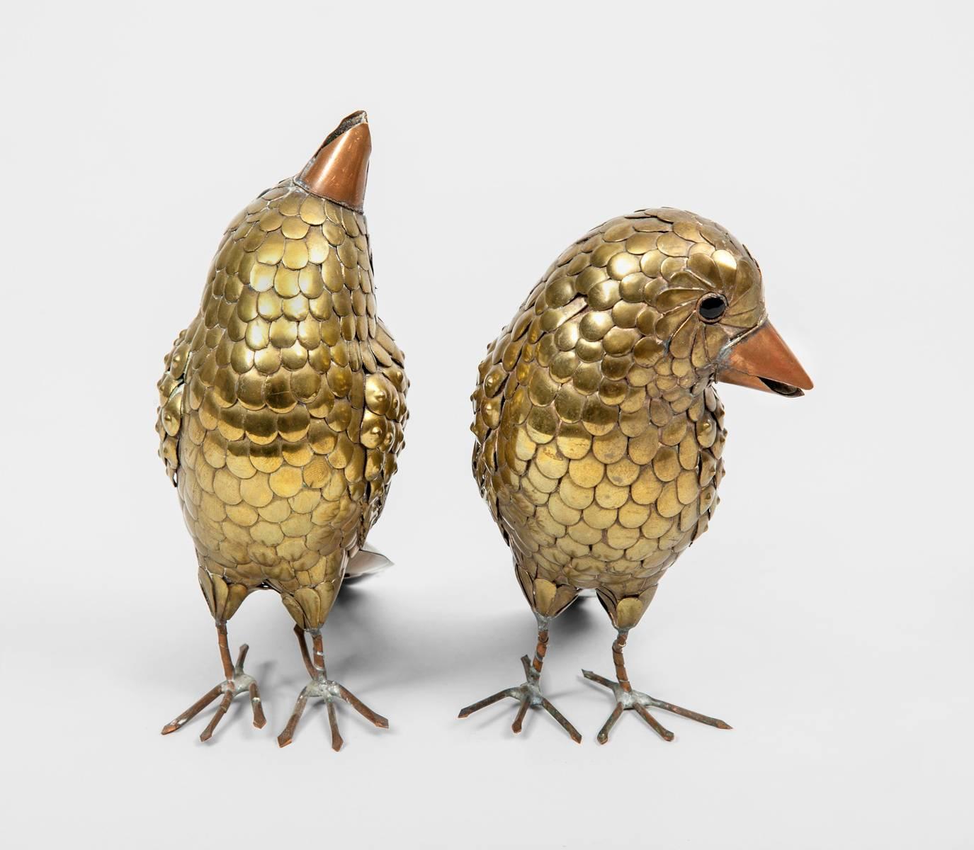 Pair of brass birds by Mexican artist Sergio Bustamante with copper beaks and feet.