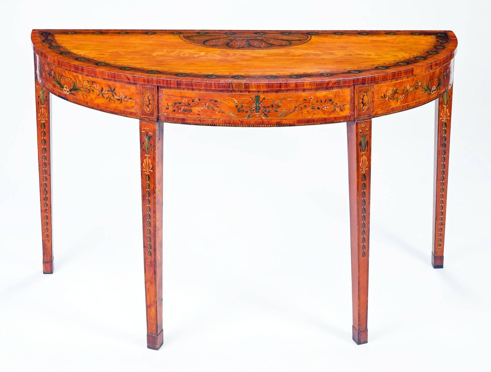 Superb Georgian, possibly period Adam, satinwood and painted demilune or D-shaped console table, inlaid with rosewood, decorated around the top edge with painted peacock feathers, centered by a half-round floral pattern, the frieze centered by a