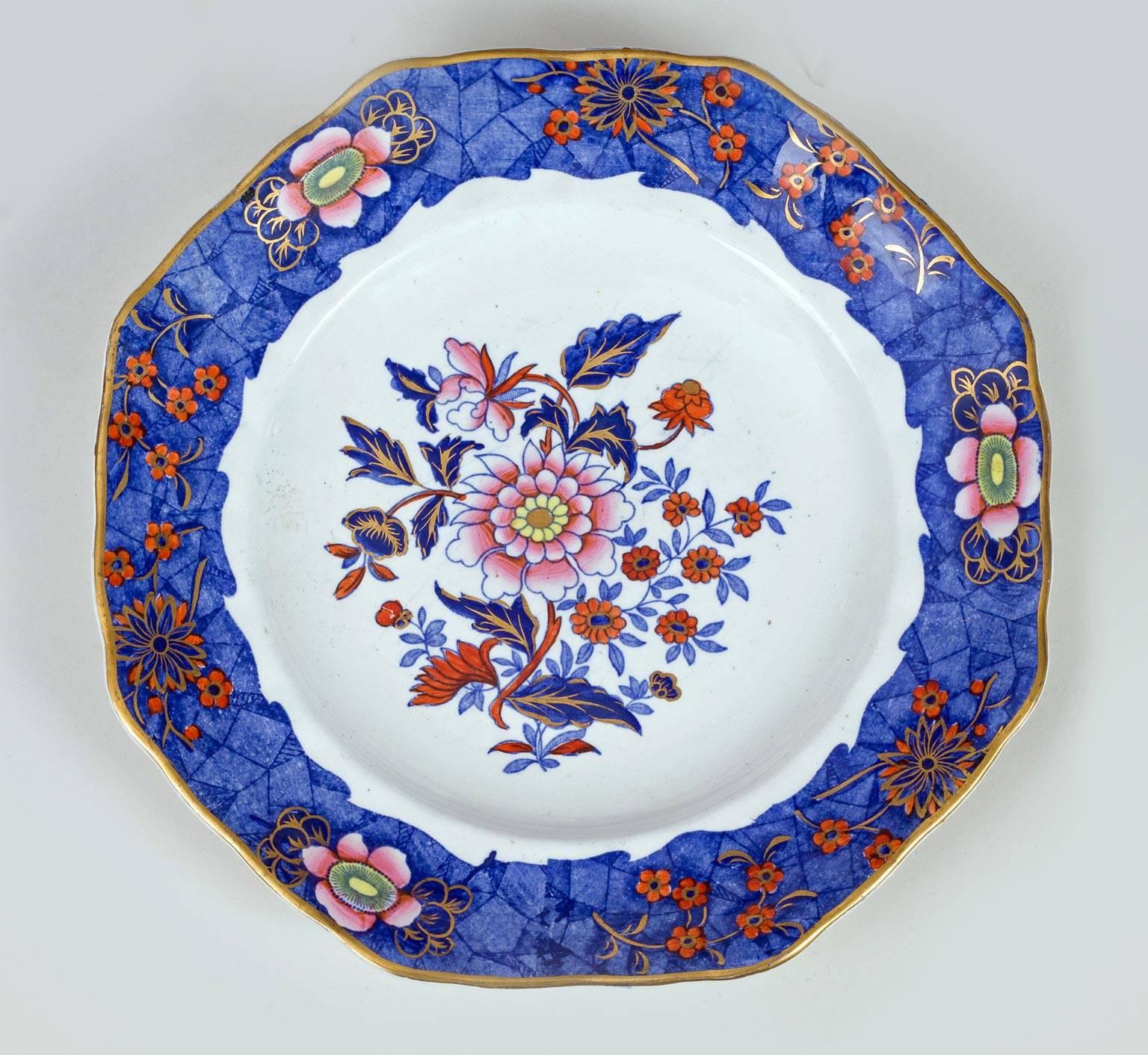 Copeland & Garrett Late Spode partial dessert service of ten pieces comprised of six octagonal plates and four shell shaped cake plates. The border is decorated in polychrome enamels of a cracked ice pattern of cobalt blue with pink flowers and