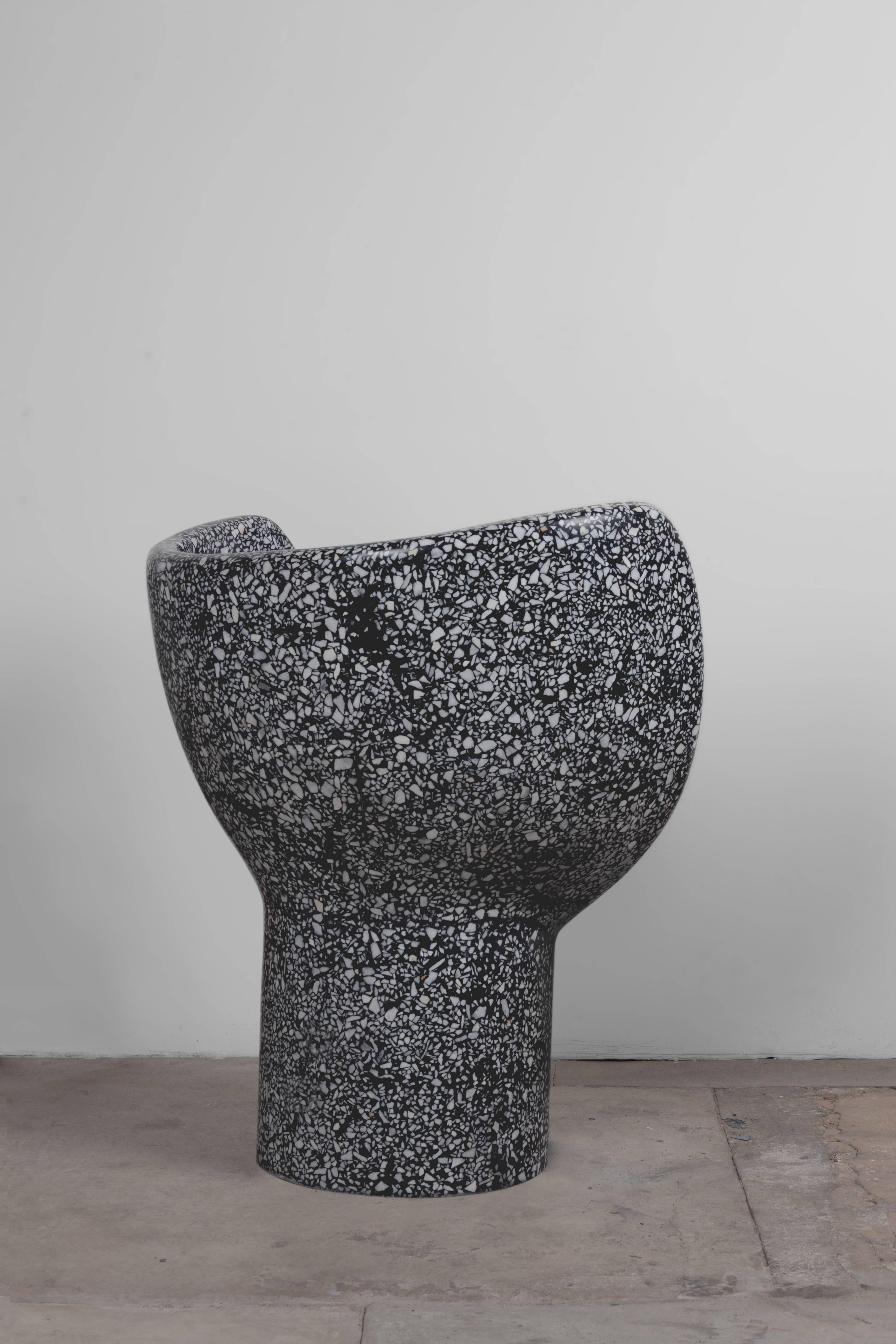 Sculptural Terrazzo chair.
Black cement, white marble aggregate, resin snake detail.
 