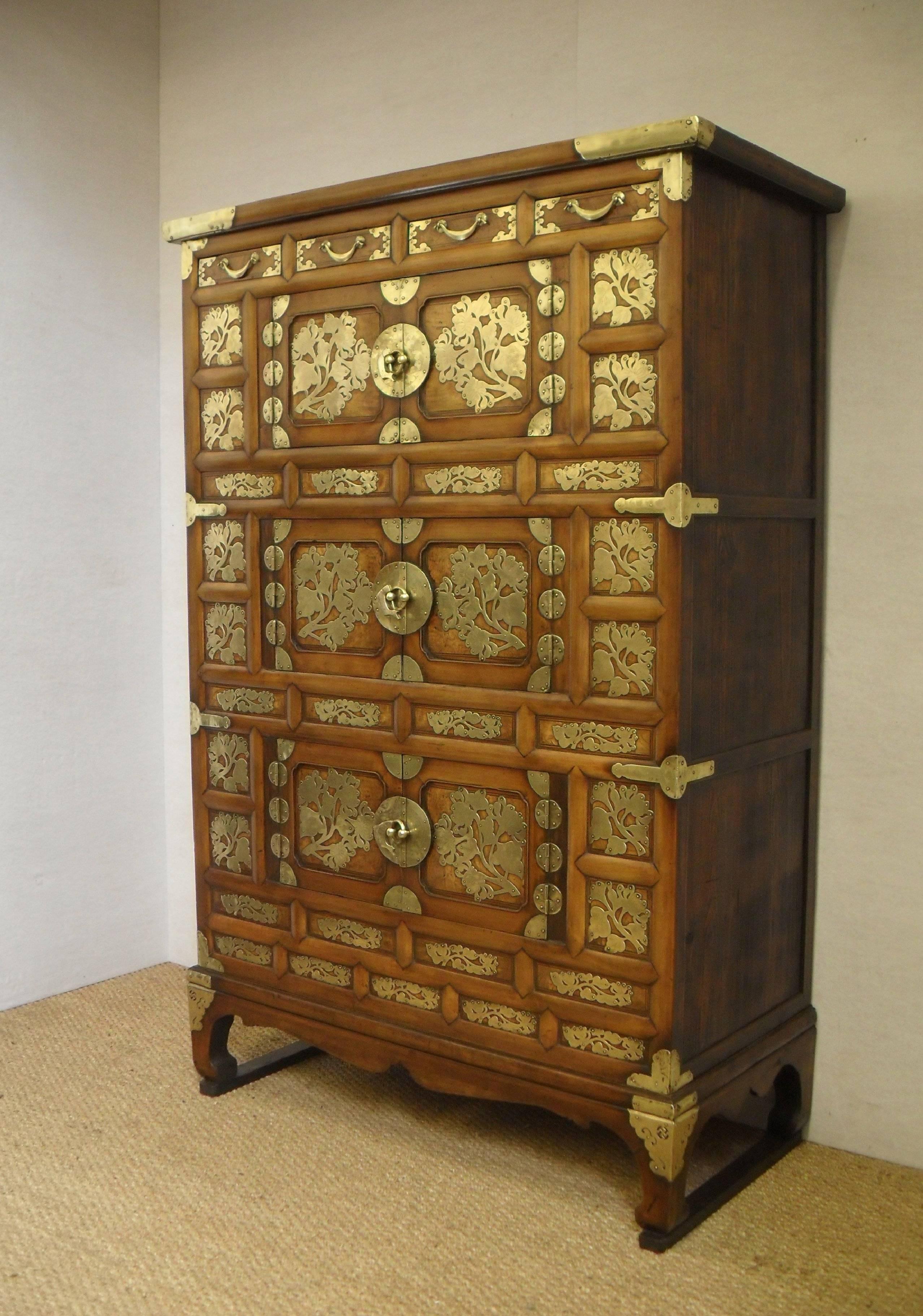 An exceptional quality and highly decorated Korean Joseon Dynasty three-tier sam-cheung-jang Tansu. The Tansu has pine panelled sides and back, with a pear wood frame and burr elm (zelkova) panels to the front with persimmon string inlay. The Tansu
