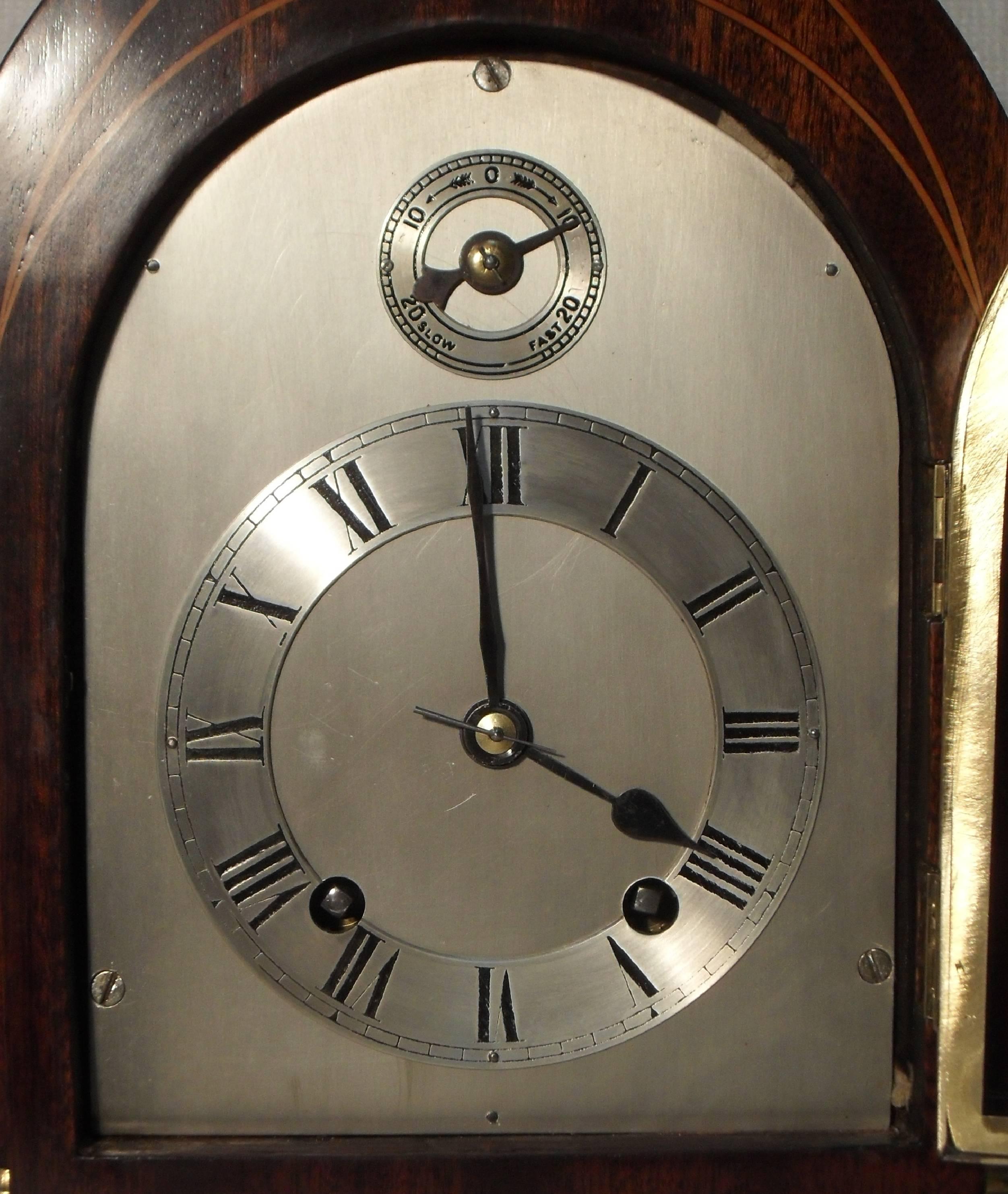 A very good quality late Victorian mahogany lancet top bracket or table clock with boxwood stringing and quarter columns to the front of the case.

The clock has a silvered dial with a slow-fast mechanism and has a German Winterhalder and Hofmeier