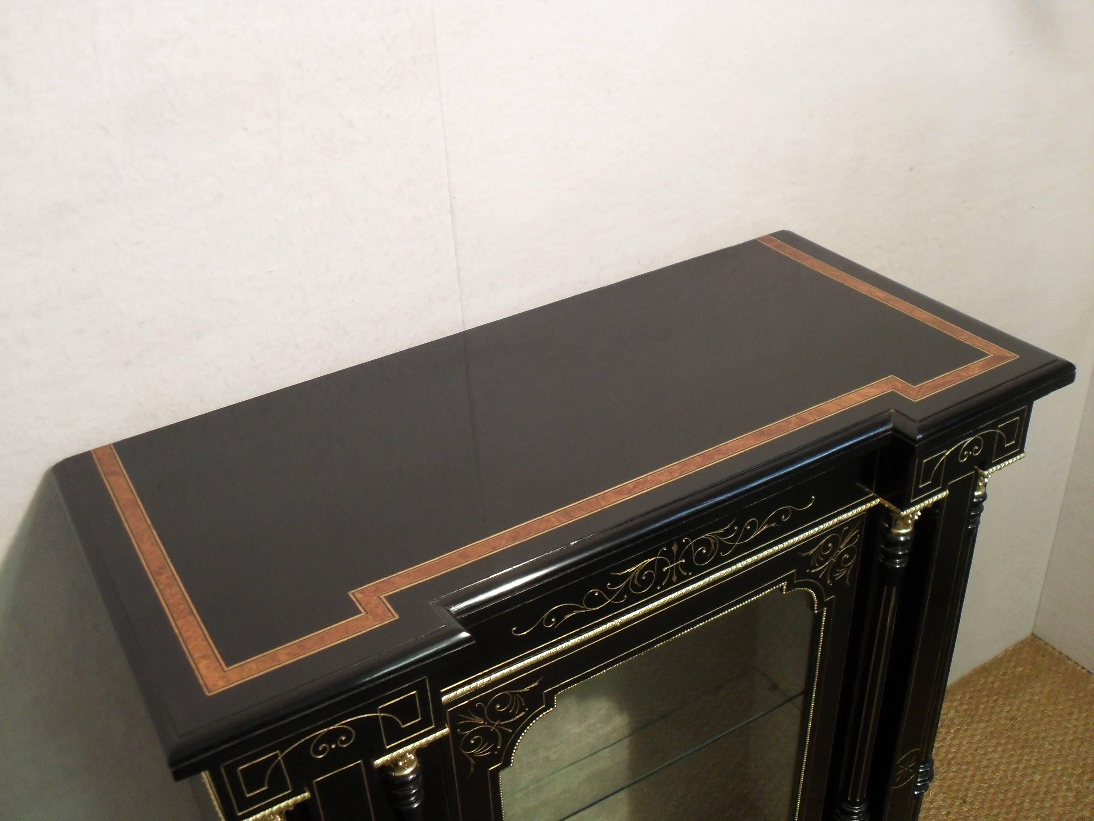 Gilt Pair of Victorian Aesthetic Movement Ebonized Display Cabinets or Bookcases