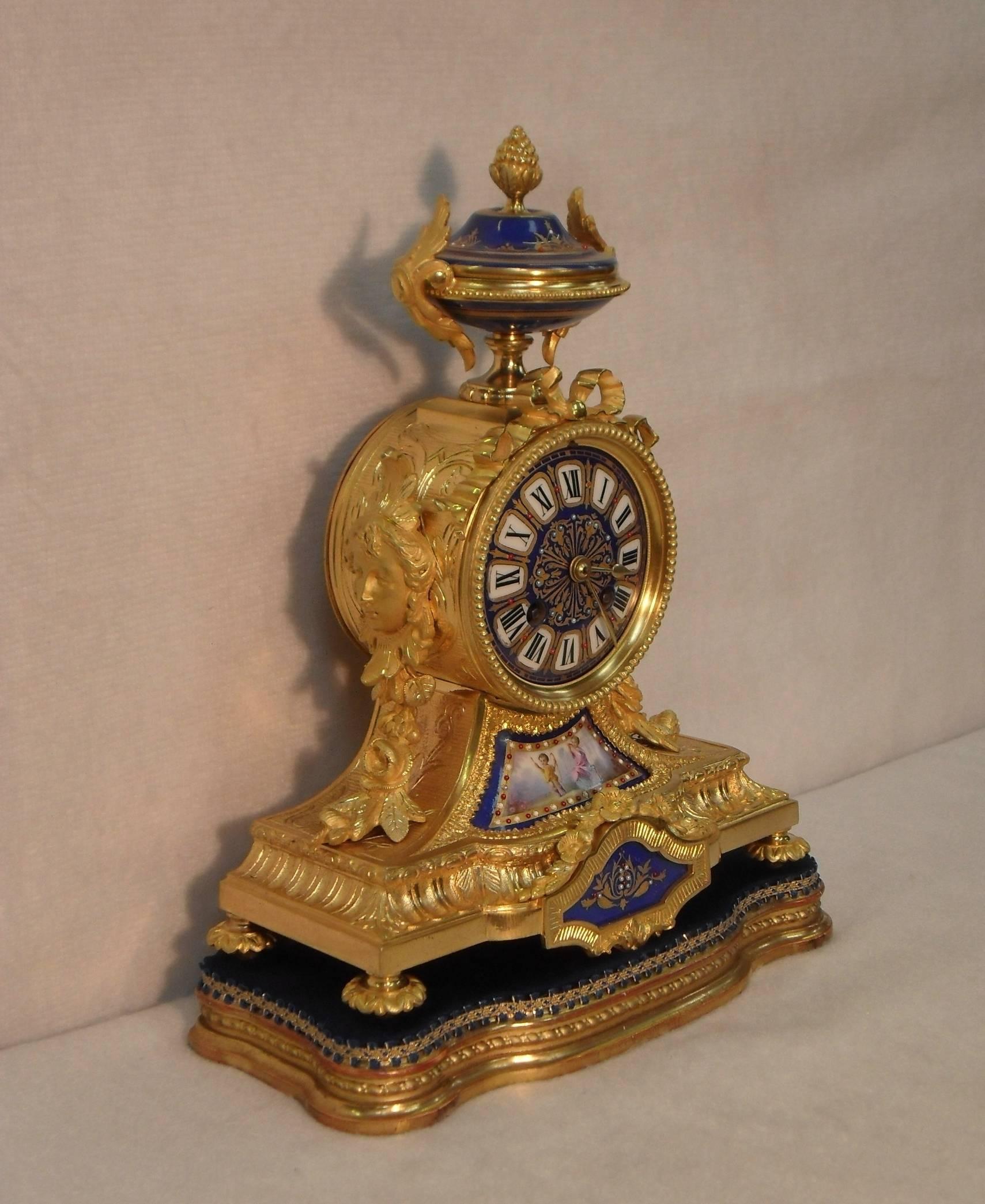 Louis XVI French 19th Century Bronze Gilt Mantel Clock with Serve Style Panels