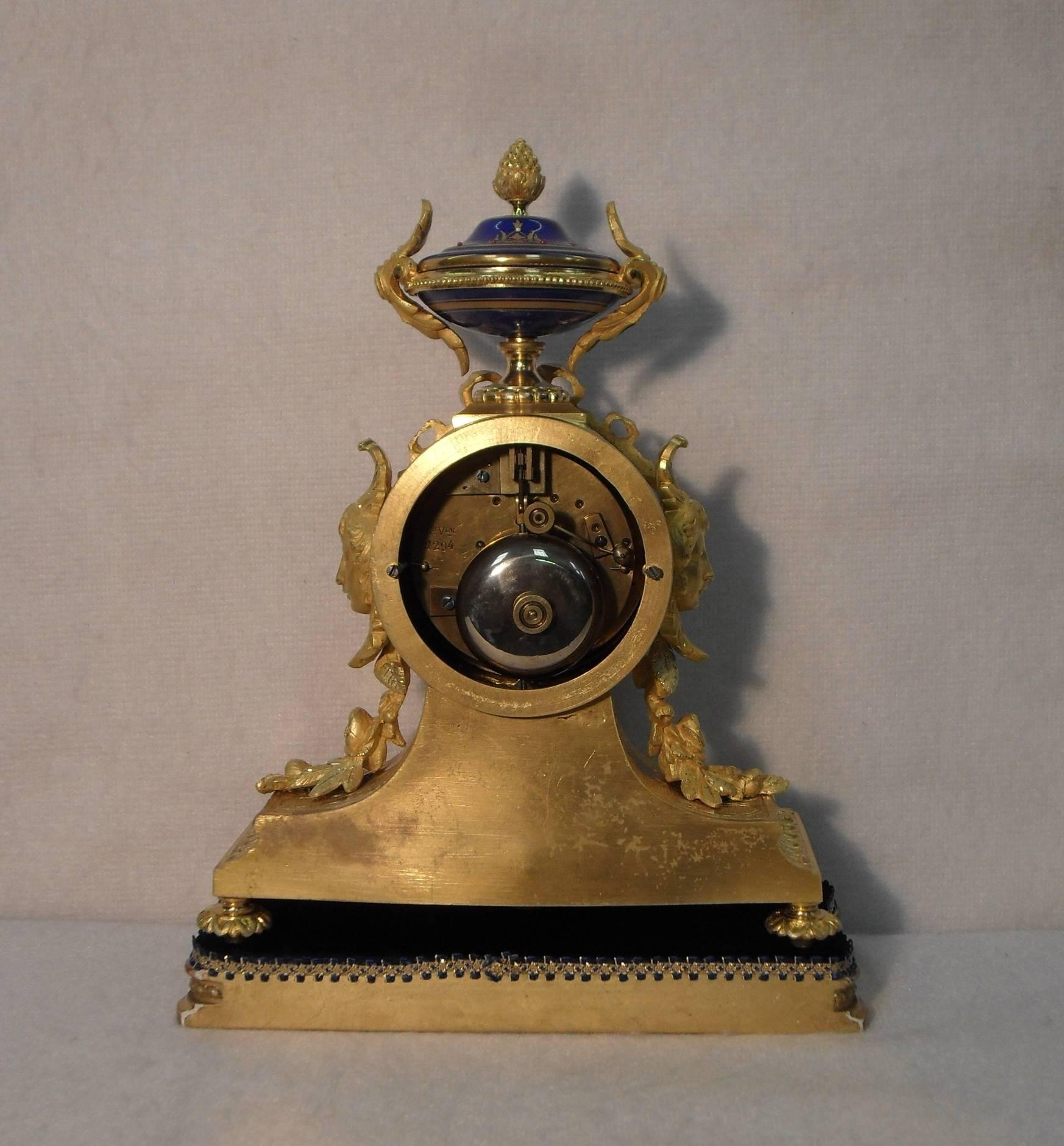French 19th Century Bronze Gilt Mantel Clock with Serve Style Panels 1