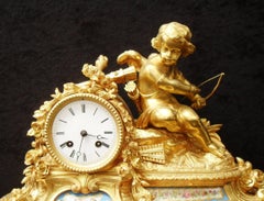 French 19th Century Bronze Gilt Mantel Clock with Porcelain Panels