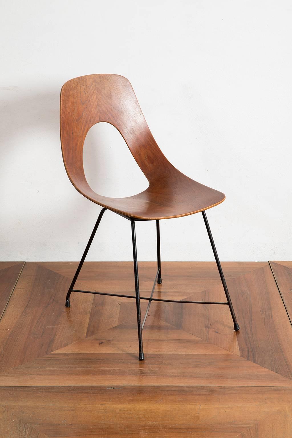 Rare set of six 'Ariston' chairs designed by Augusto Bozzi in 1957 and manufactured by Saporiti, Italy. This set is made out of a solid bend plywood piece of teak have a very elegant shape, which provides them with a very clean cut line. Equipped