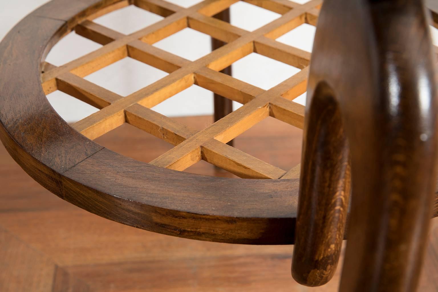 Coffee table attributed to Paolo Buffa with four curved sculptural legs in solid walnut wood and inset glass on the top.
 
Paolo Buffa was born in 1903 in Italy. He is graduated of the Polytechnic Institute of Milan. After his studies, he worked for