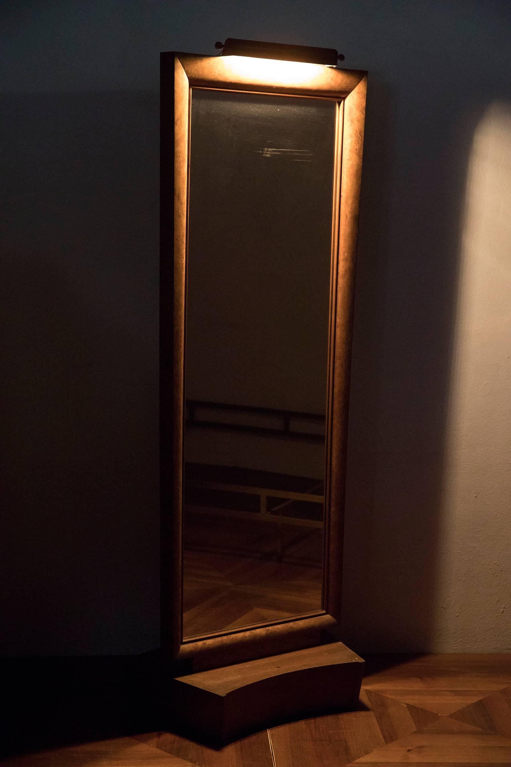 A unique piece designed by Tomaso Buzzi and manufactured by Fernando Loreti carpentry in Rome for Giovanni Gentile, philosopher and Italian Minister of Education, residence. A floor-standing mirror in veneered wood, with a rectangular convex shape