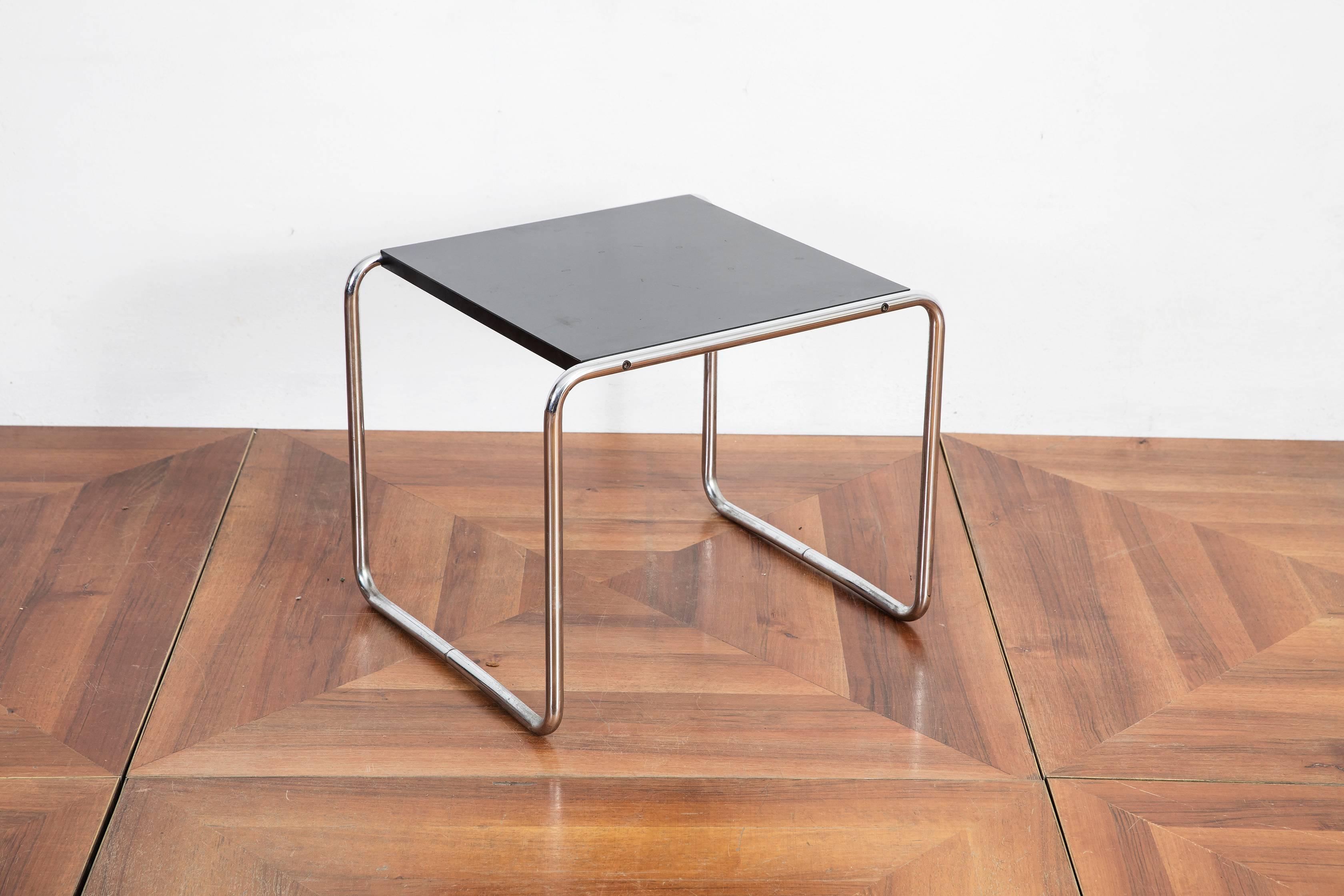 Beautiful and original Gavina black Laccio side table designed by Marcel Breuer. Steel frame and black laminated wood tabletop.
Originally the tables were produced by Thonet. From 1962 until 1968 by Gavina and after 1968 by Knoll.

The Laccio