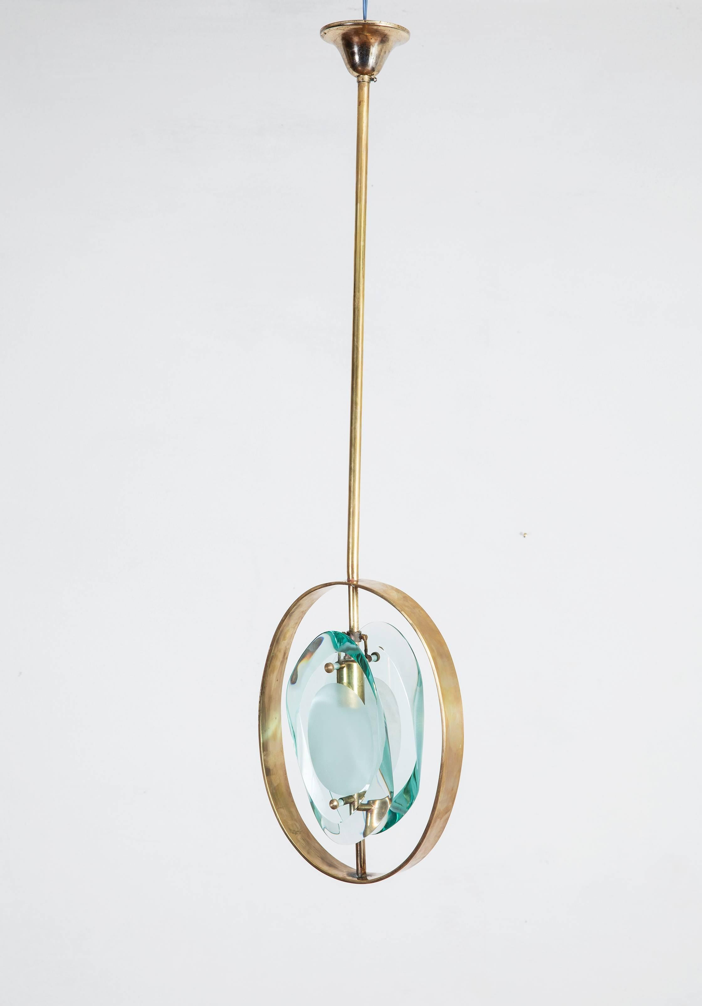 A wonderful original pendant ceiling light designed by Max Ingrand for Fontana Arte, circa 1961.
Model no 1933, from the Micro series, one of the iconic series by Max Ingrand, dated 1961, the light is made from two cut and carved glass chunks