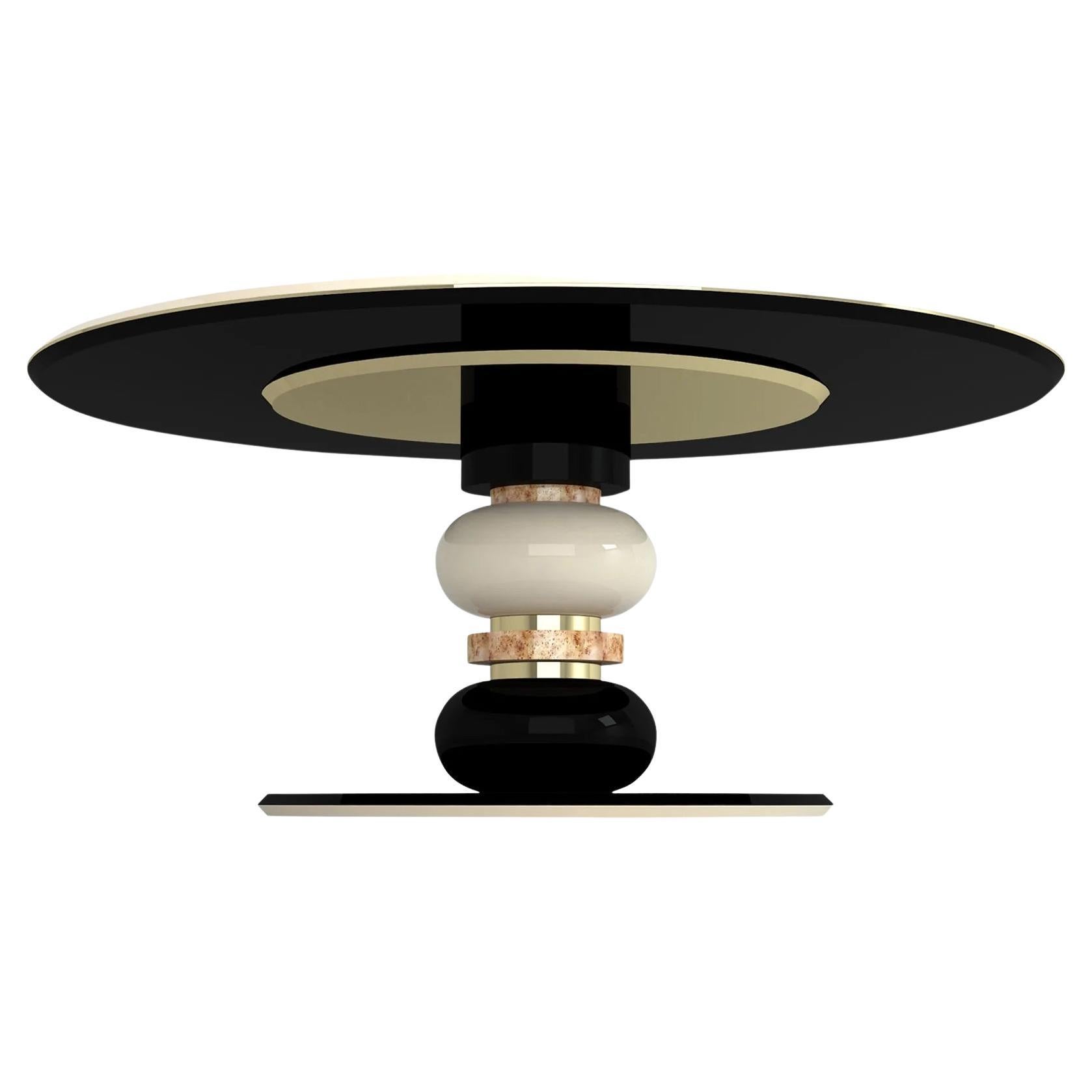 This stylish piece brings to mind the world of beauty and jewelry. Handmade primarily from glossy lacquered wood surfaces in black and cream. The table is then framed at junctures by Poplar Root and polished brass rings.
Measures: H: 78 cm 30.7’’
D: