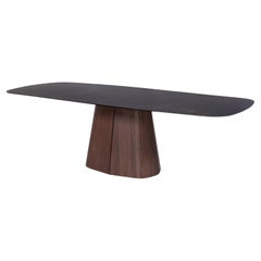 Sculptural Dining Table with Oval Shaped Black Ceramic Top/Walnut Base