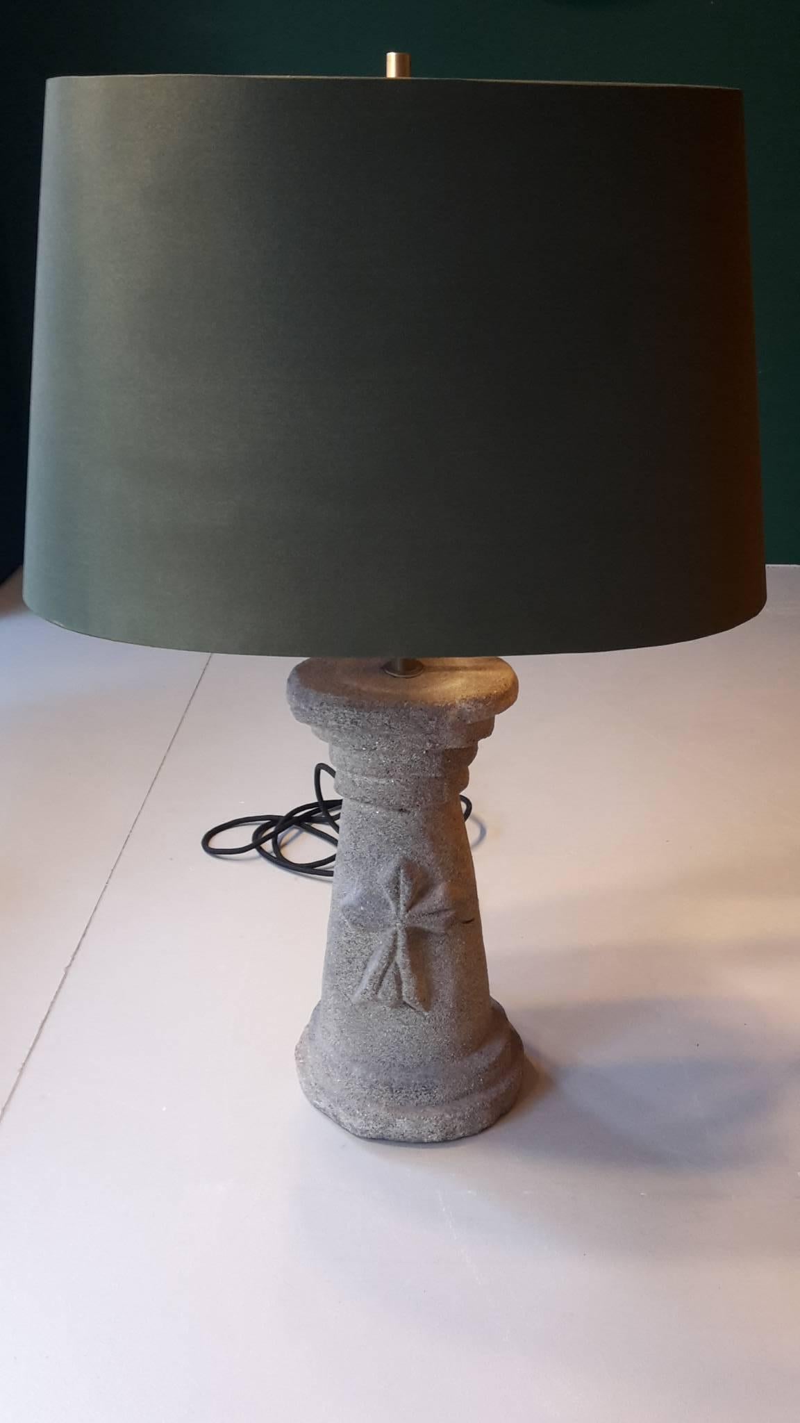 20th Century French table lamp with a foot made of carved stone with a rich grainy surface.