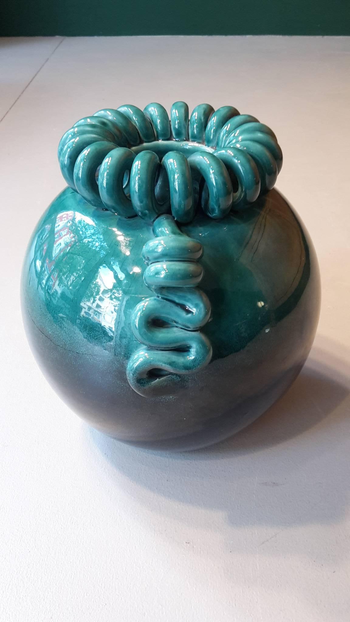 20th century French round Art Deco ceramic vase with a delicate cracked glaze that fades from teal to black.