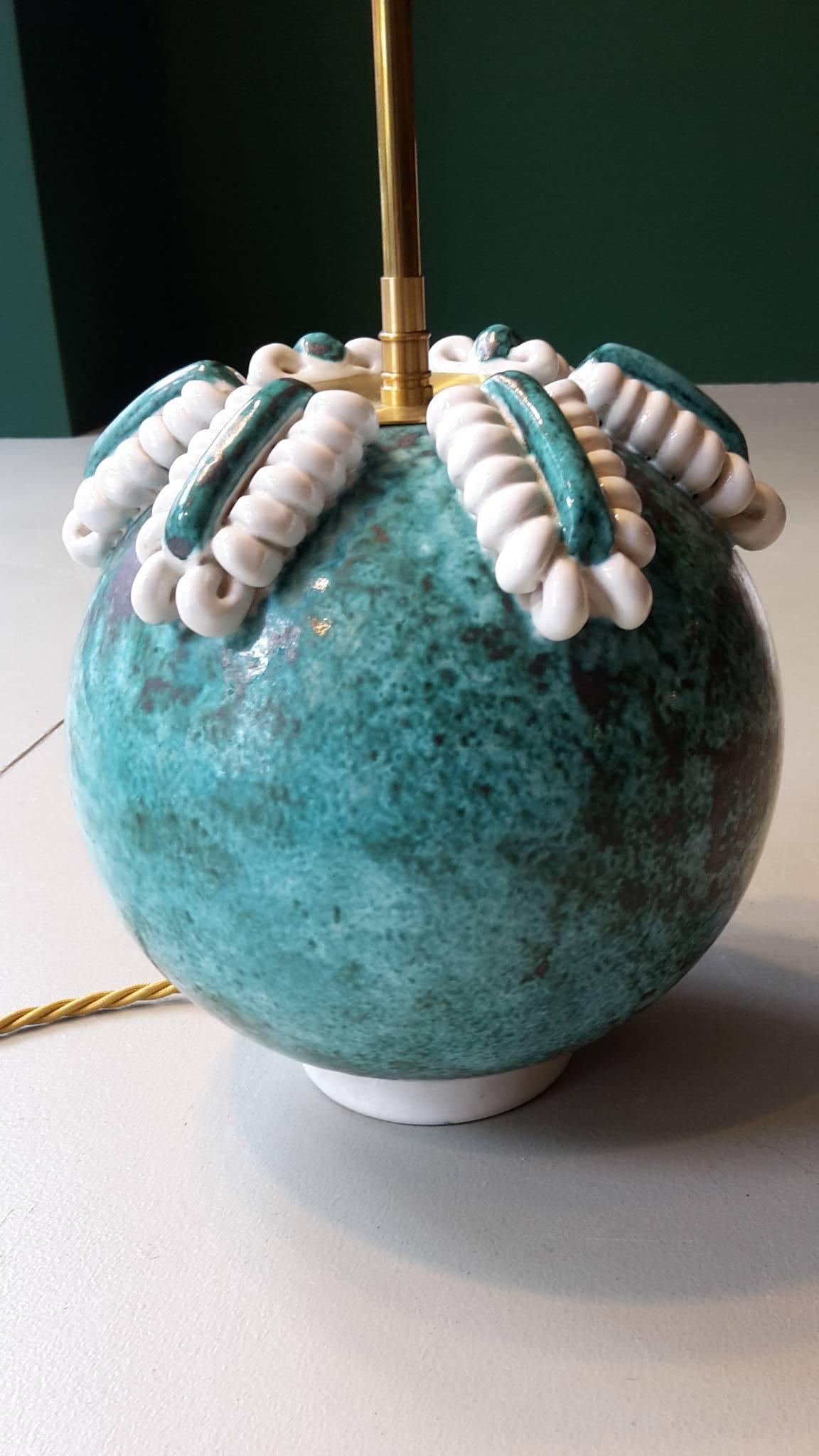 Early 20th century Art Deco table lamp made of turquoise and white ceramic.