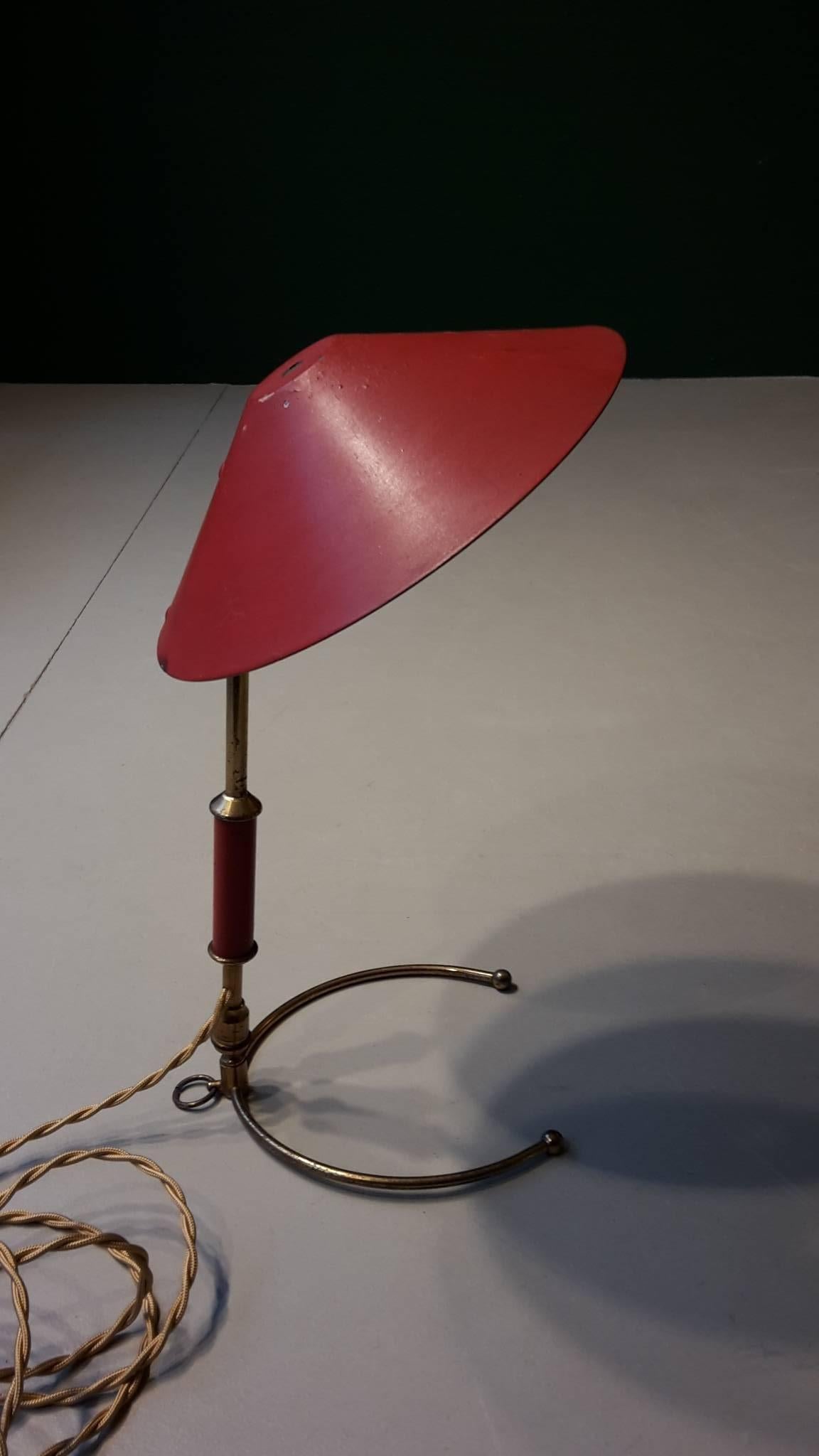 20th century French red reading lamp made of brass and enameled metal 1960s. The shade and the arm are adjustable.