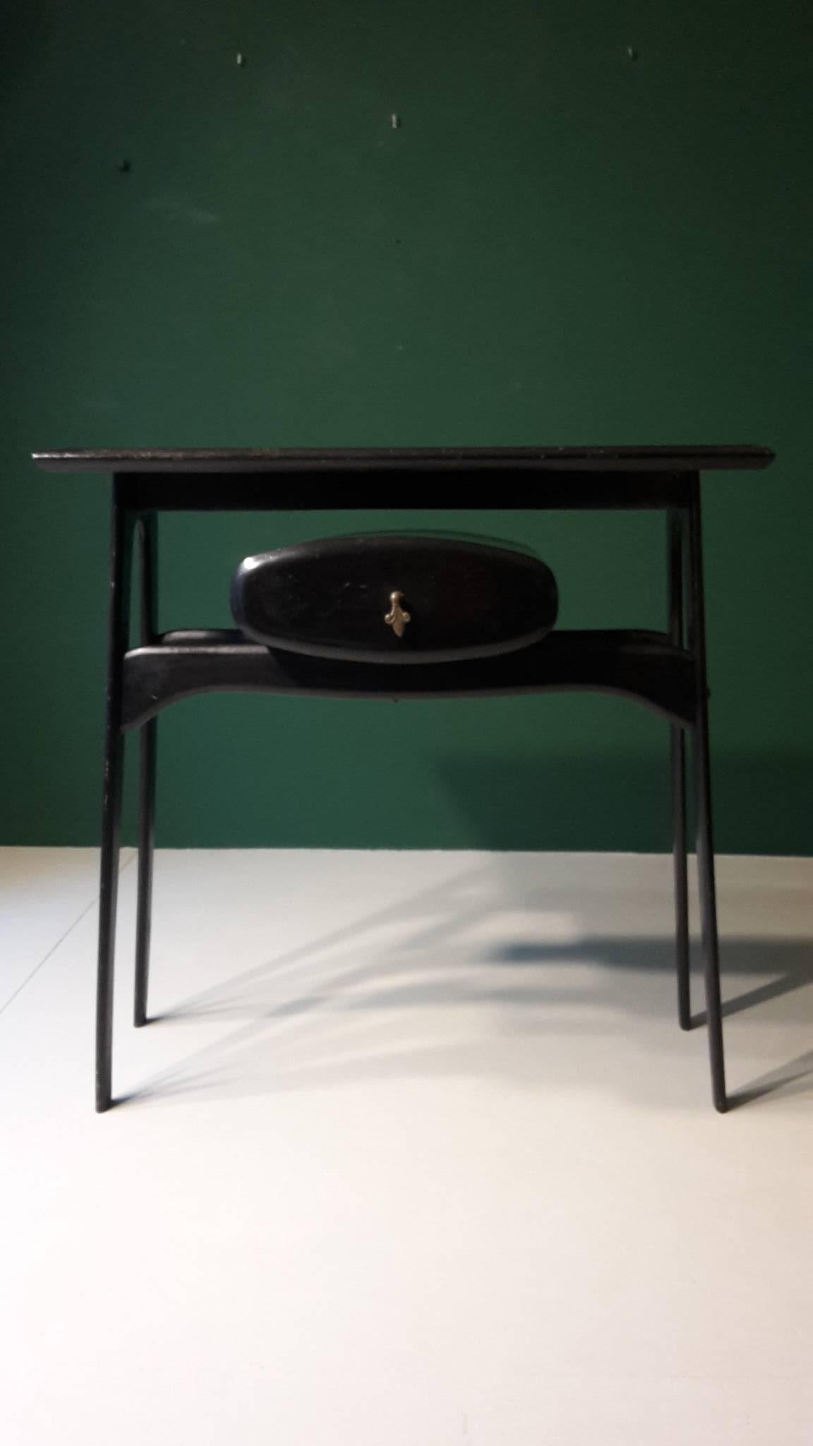 20th century black Italian console made of wood and glass from the 1960s.
