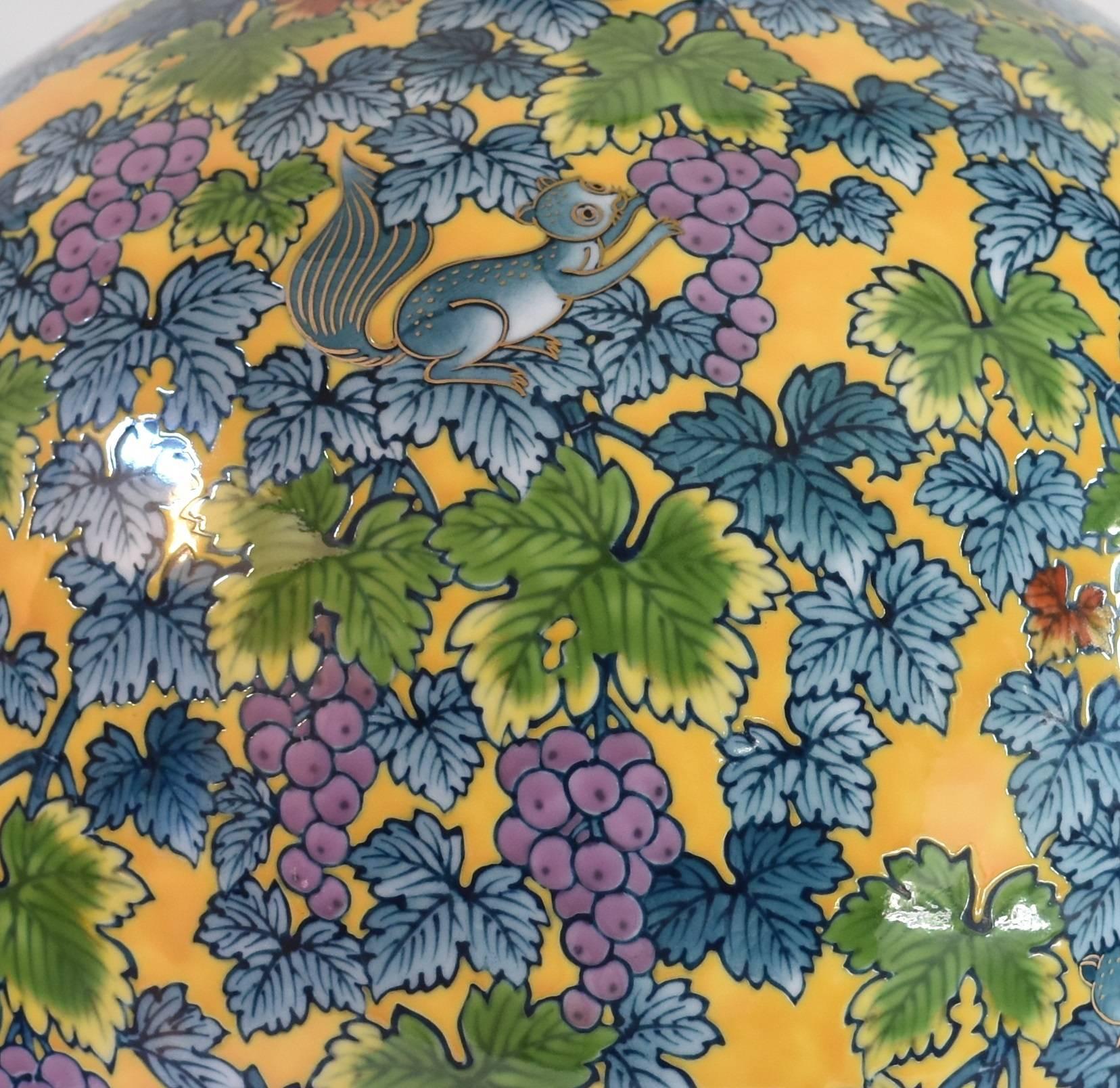 Unique large Japanese contemporary decorative vase, hand-painted on a beautifully shaped high quality porcelain body in vivid yellow, blue and green, a signed piece by highly acclaimed award-winning master porcelain artist of the Imari-Arita region