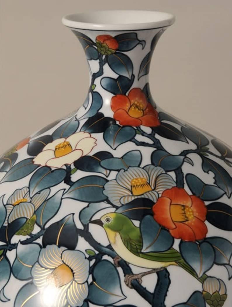 Striking very large Japanese hand painted porcelain vase, a signed masterpiece by highly acclaimed award-winning master porcelain artist in overglaze enameling. The striking baluster shape body serves as a perfect canvas for stunning camellia