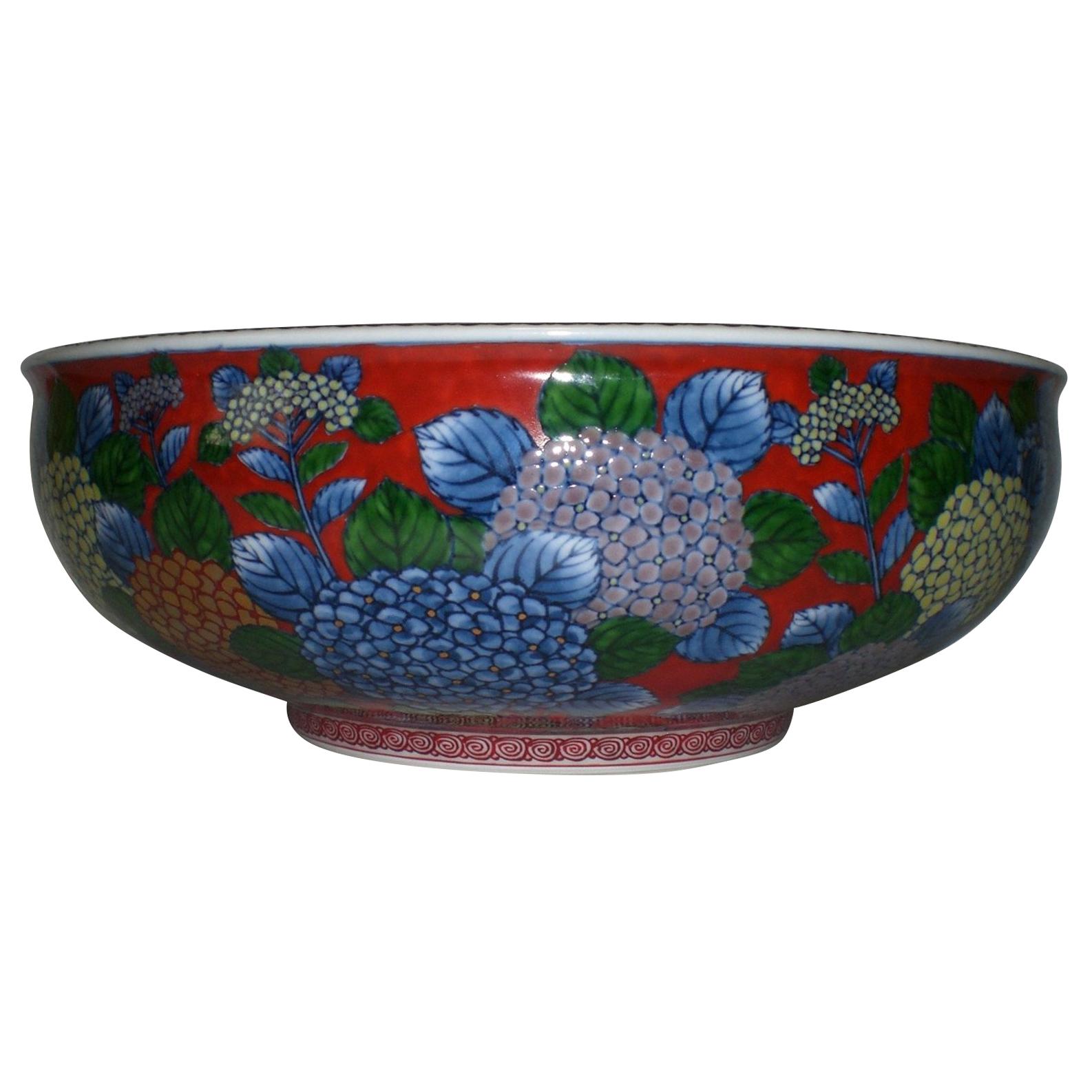 Exceptional Japanese contemporary decorative porcelain bowl/centerpiece, intricately hand painted on a elegantly shaped body in red and blue, a signed masterpiece by second-generation master porcelain artist of the Imari-Arita region of Japan. This