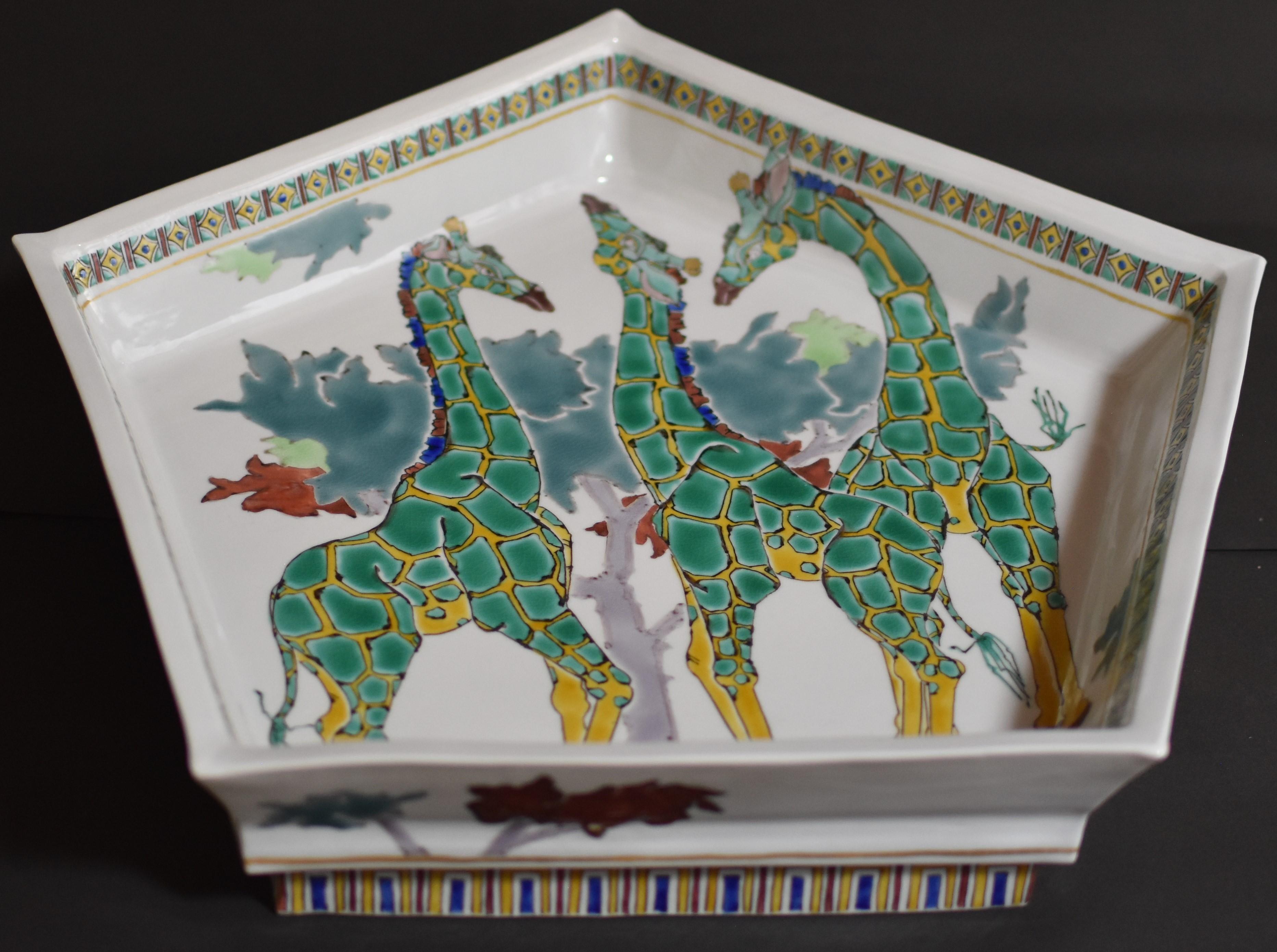 Exceptional contemporary Japanese museum-quality porcelain raised deep charger/centerpiece, hand-painted in vivid green and yellow, in a stunning Pentagon shape. It showcases a unique interpretation of giraffes and is a signed masterpiece by a
