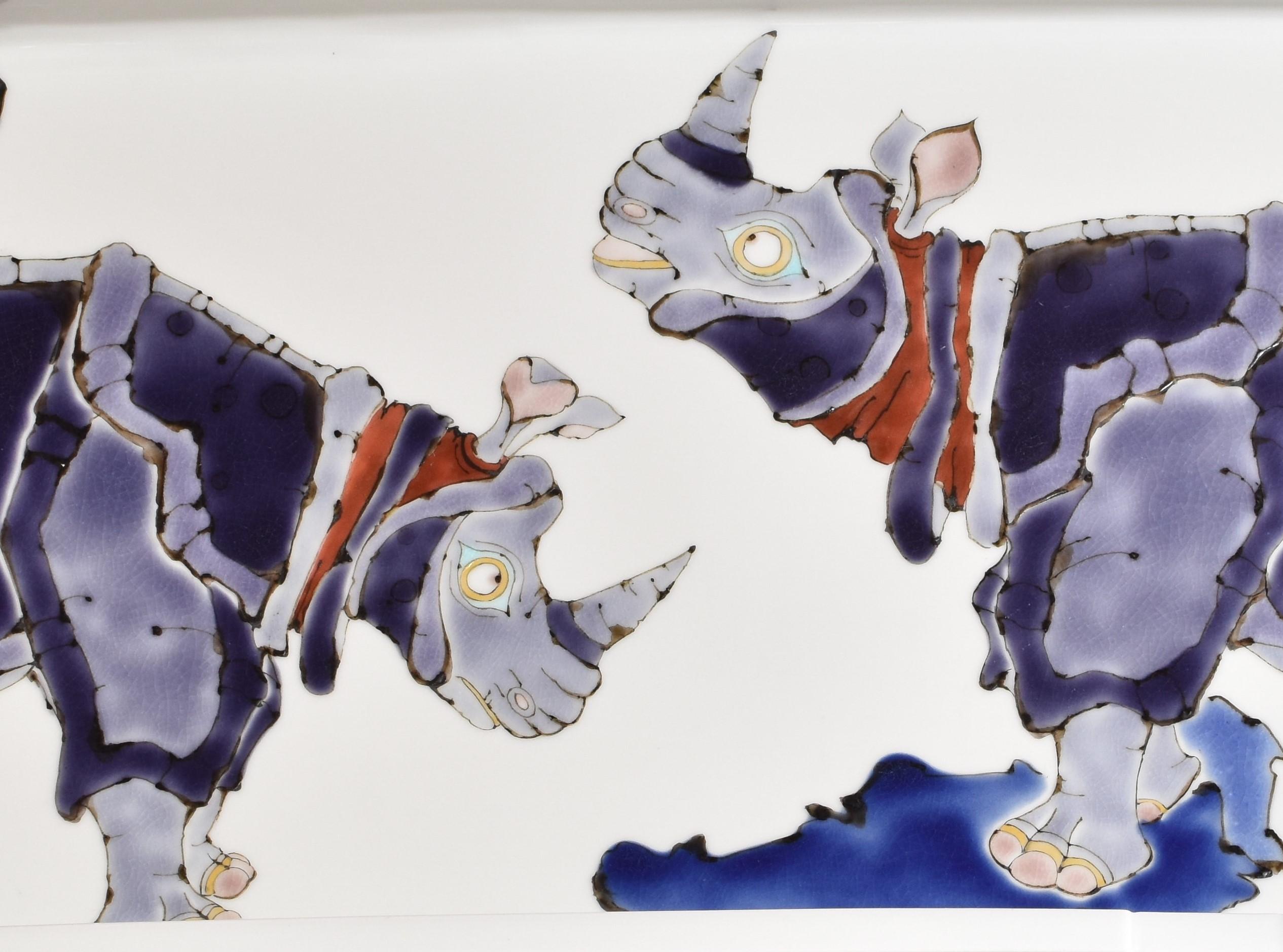 Exceptional very large Japanese contemporary decorative signed porcelain charger, hand painted on a beautifully shaped rectangular body in stunning hues of blue and purple showcasing a unique interpretation of the rhinoceros, a masterpiece by highly