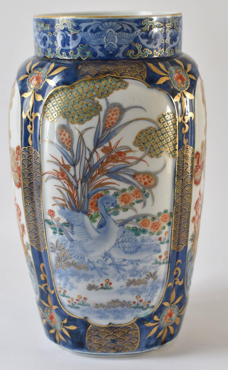 Extraordinary Japanese semi-square Koransha porcelain vase from Meiji Period (circa 1880,) intricately hand-painted in polychrome enamels in red and cobalt blue over clear glaze and detailed gild decoration all around. The mark depicts the Koransha