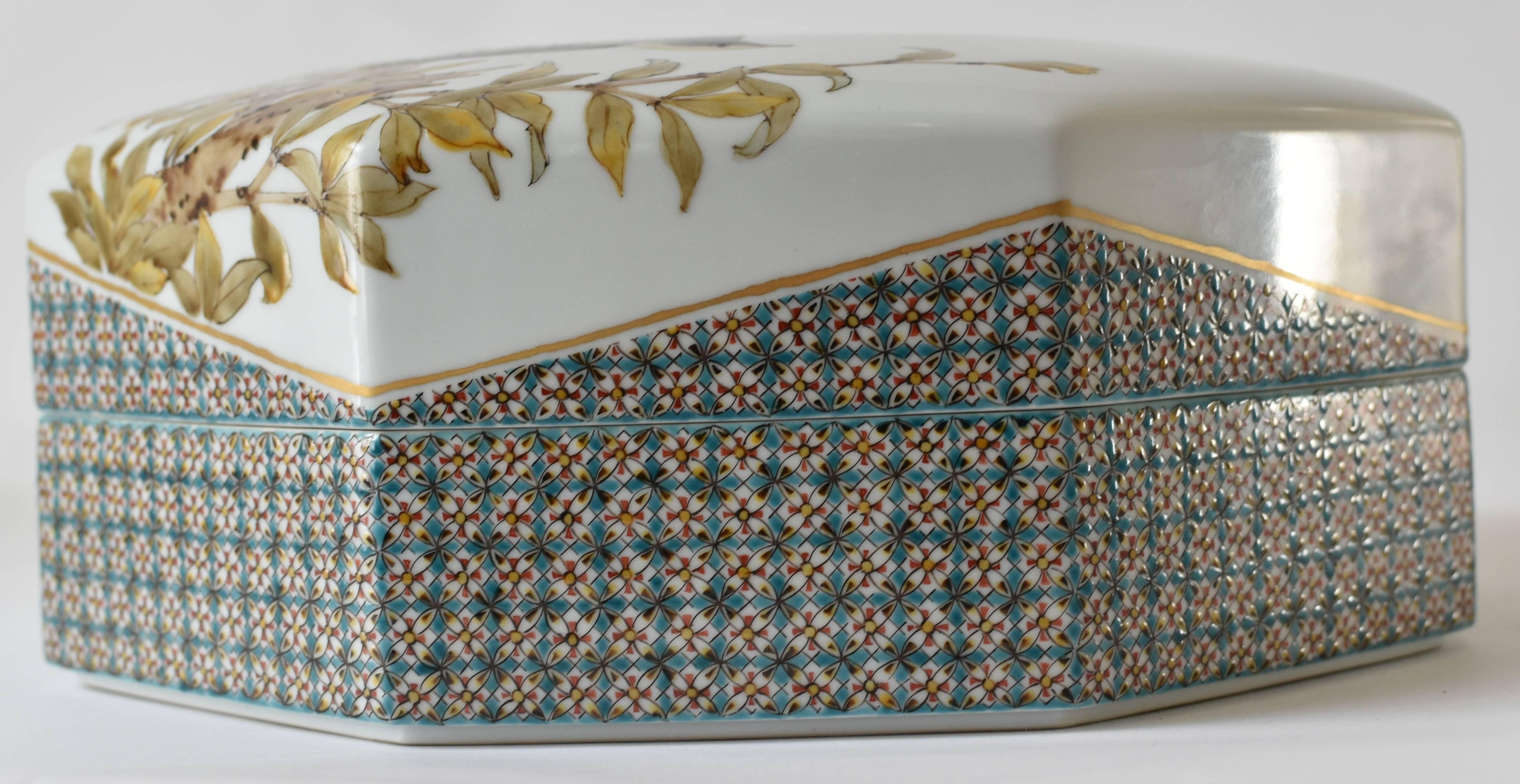 Magnificent Japanese contemporary decorative porcelain box/centerpiece, a highly collectible exhibition piece extremely intricately hand-painted in vivid blue, orange and green on a stunning octagonal shape body, a signed masterpiece by highly
