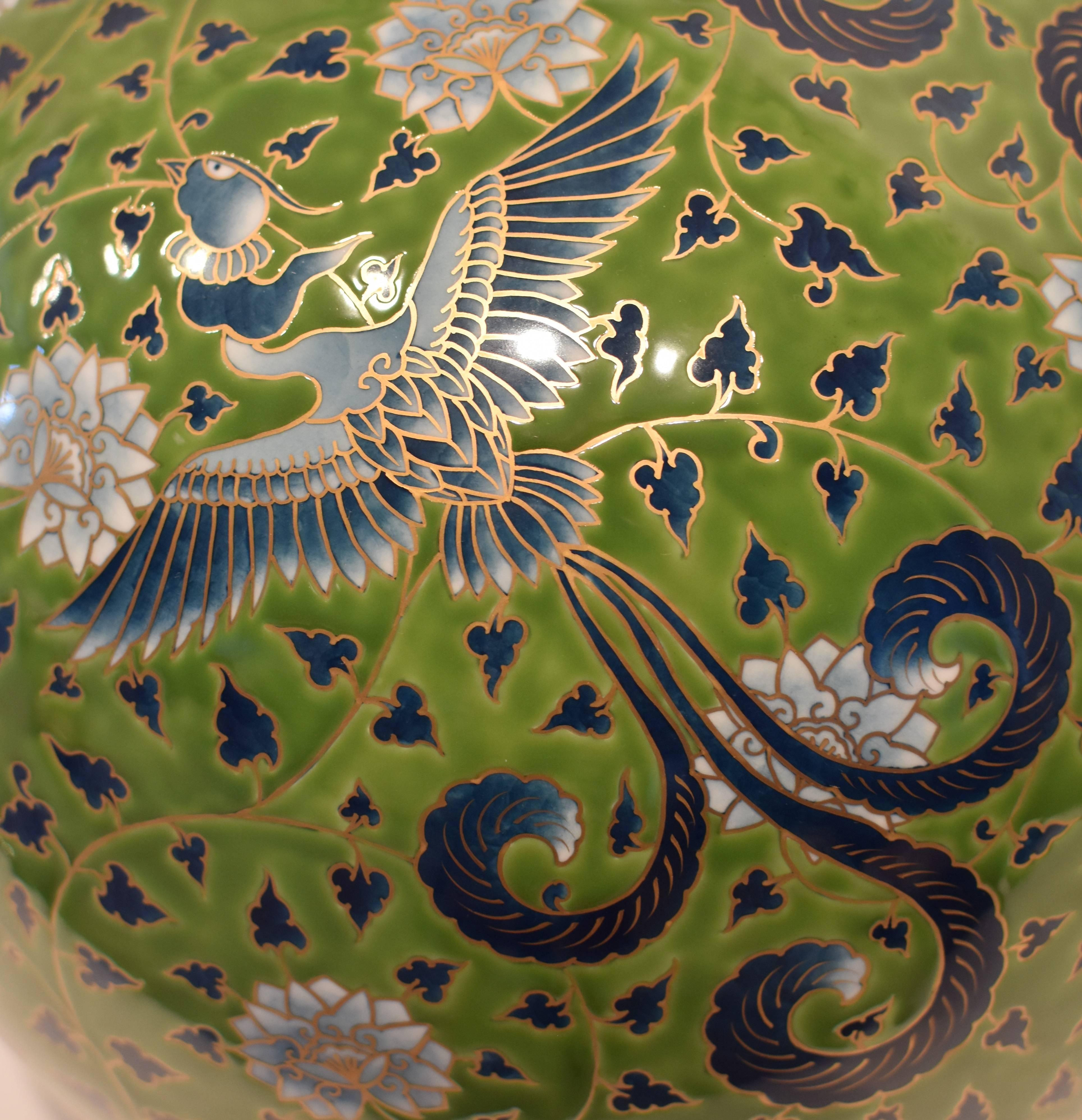 Extraordinary very large contemporary decorative porcelain vase presented in a striking globular form combining the artist's signature auspicious arabesque motif, extremely intricately hand-painted with birds and flowers set against a luminous green