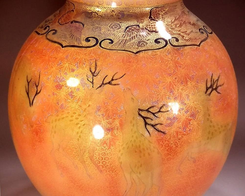 Contemporary Japanese decorative porcelain vase, hand-painted in vibrant orange and black on a stunning globular shaped porcelain body, a masterpiece from an exclusive collection of highly collectible pieces by highly acclaimed master porcelain