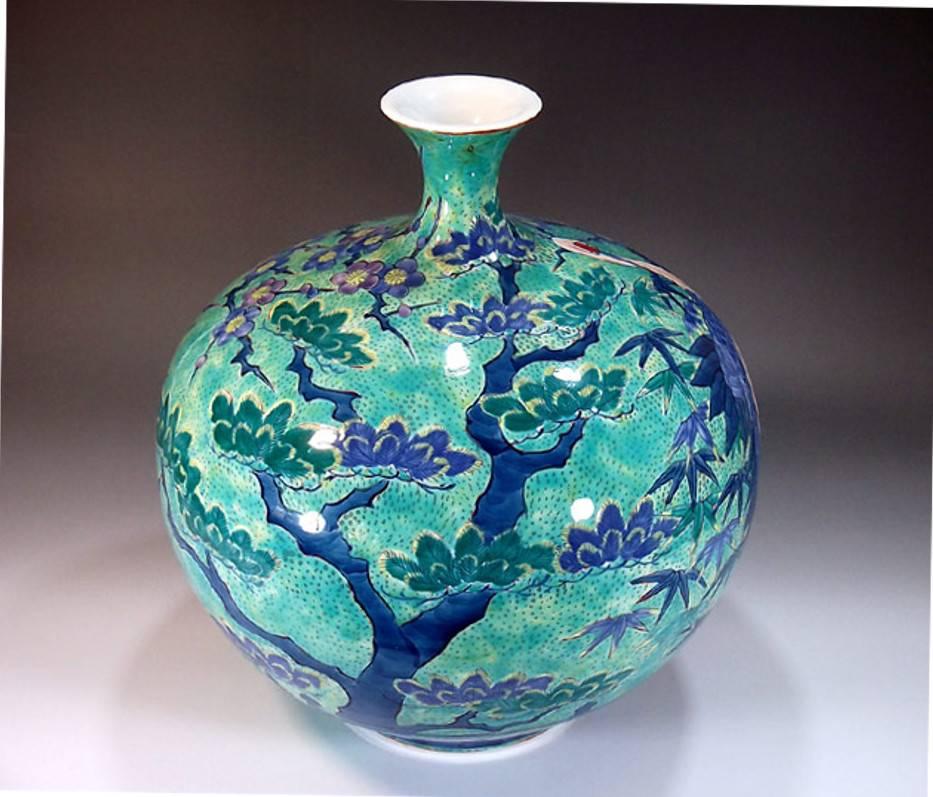 Large intriguing Japanese decorative porcelain vase, hand-painted on a beautifully shaped ovoid pure white porcelain body, a signed work by a highly acclaimed master porcelain artist of the historic Imari- Arita region of southern Japan. This artist